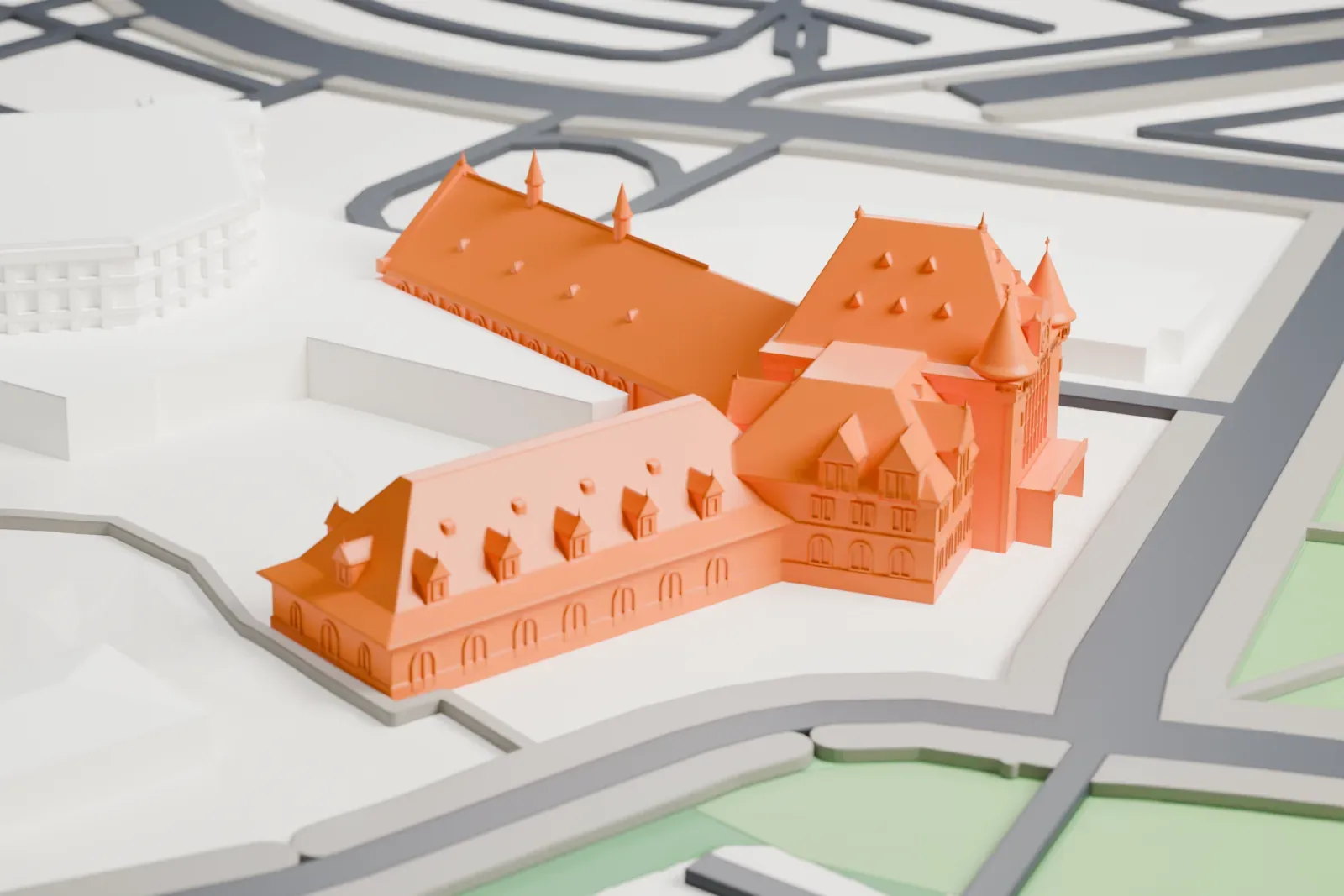 A white 3D print of Gare du Palais with the surrounding streets and buildings.