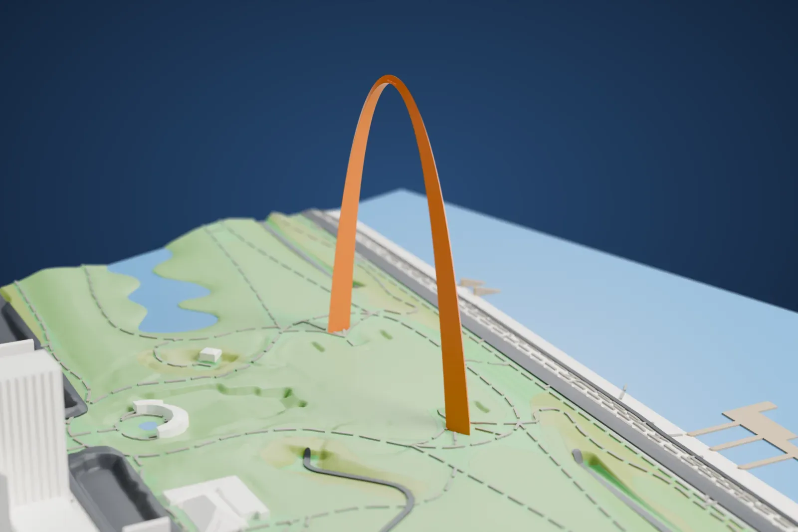 A white 3D print of the Gateway Arch, a single tall curved arch standing in a green park with paths and ponds beside a wide river and a few city buildings.