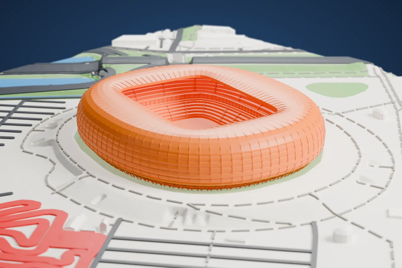 A white 3D print of Gdańsk Stadium, an oval bowl under a smooth cushion-shaped shell with an open center, standing among surrounding streets and buildings.