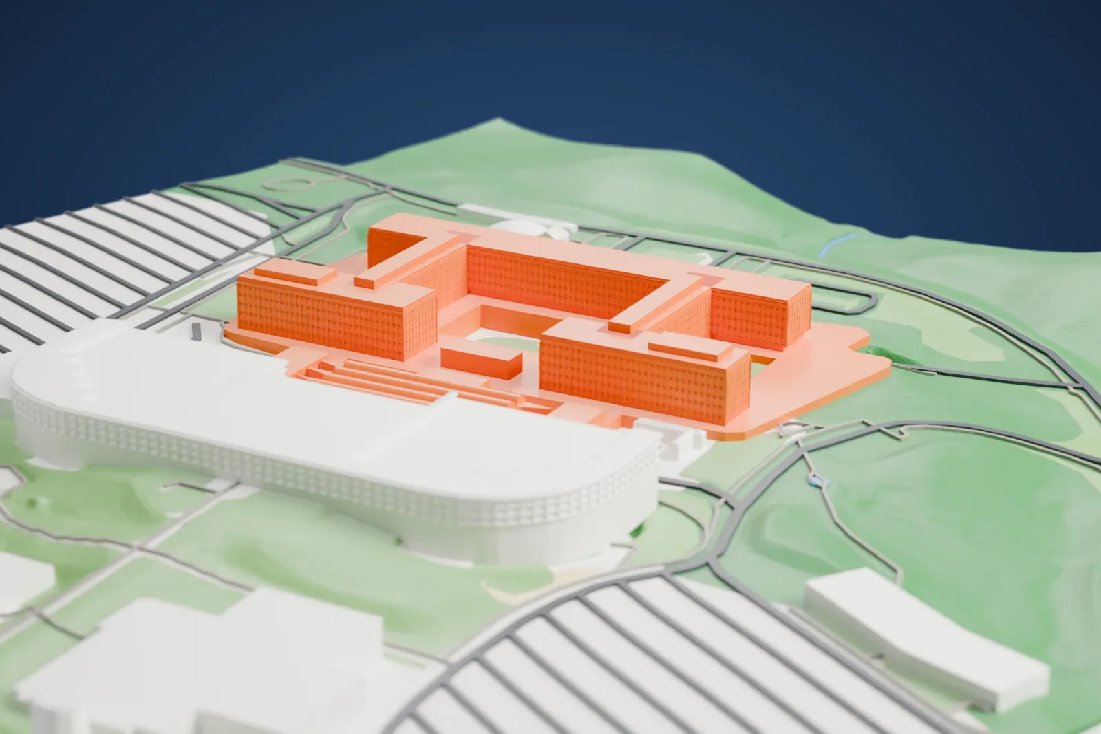 A white 3D print of the George Bush Center for Intelligence, a complex of buildings, among the surrounding area.