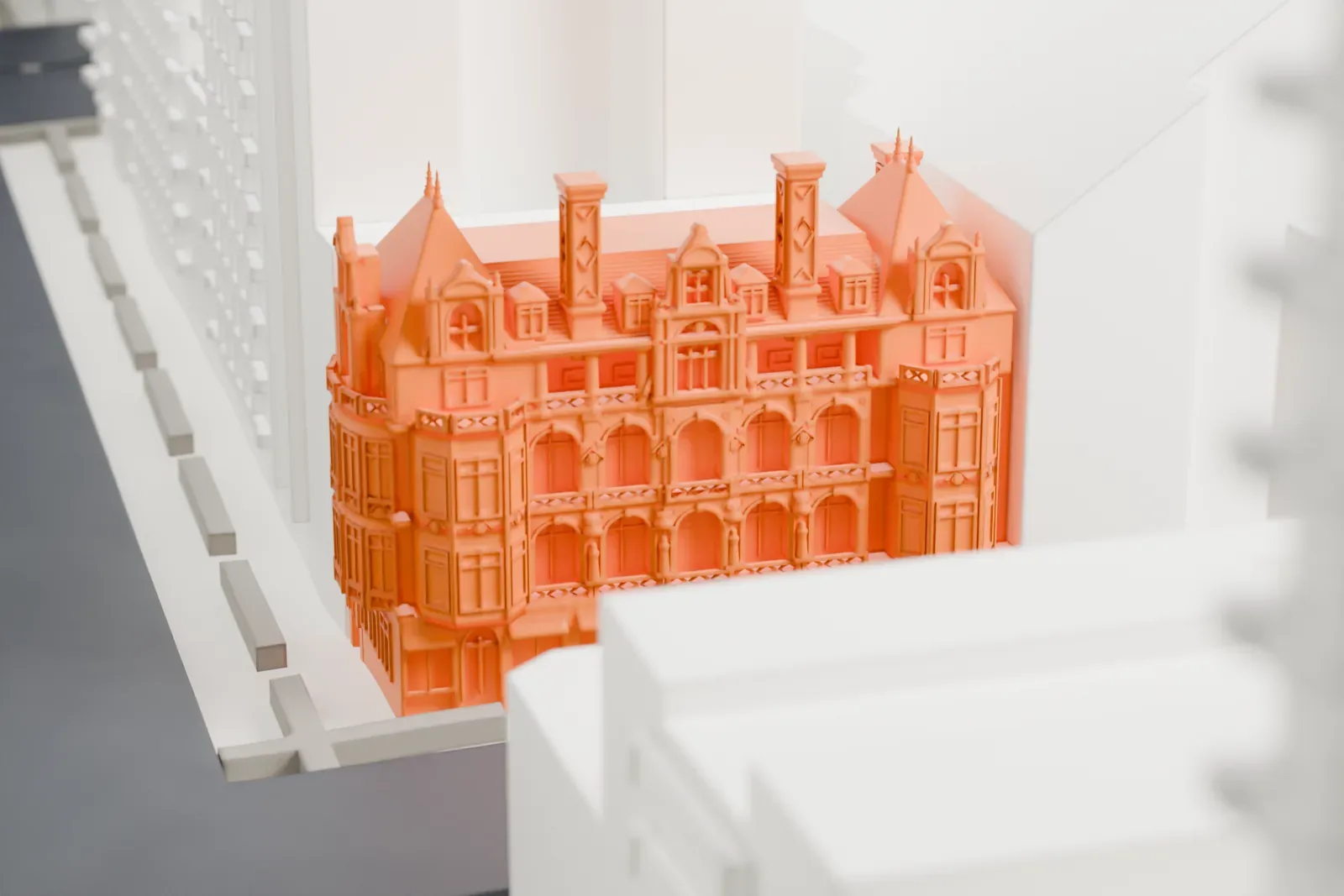 A white 3D print of the Gertrude Rhinelander Waldo House among the surrounding buildings.