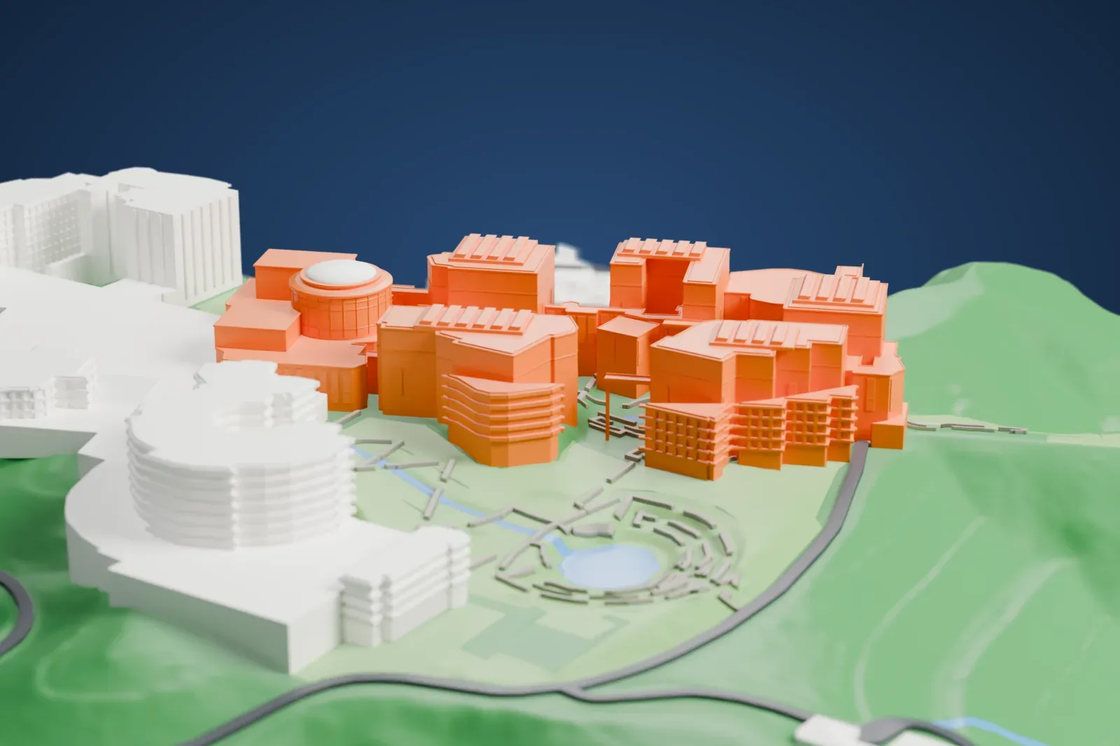 A white 3D print of the Getty Center, a cluster of blocky pavilions with a round rotunda on a green hilltop, with a terraced garden and pool beside it.