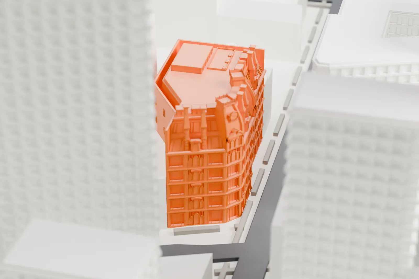 A white 3D print of Gilsey House, an eight-story building with an ornate mansard roof and chimneys, squeezed between much taller buildings on narrow city streets.