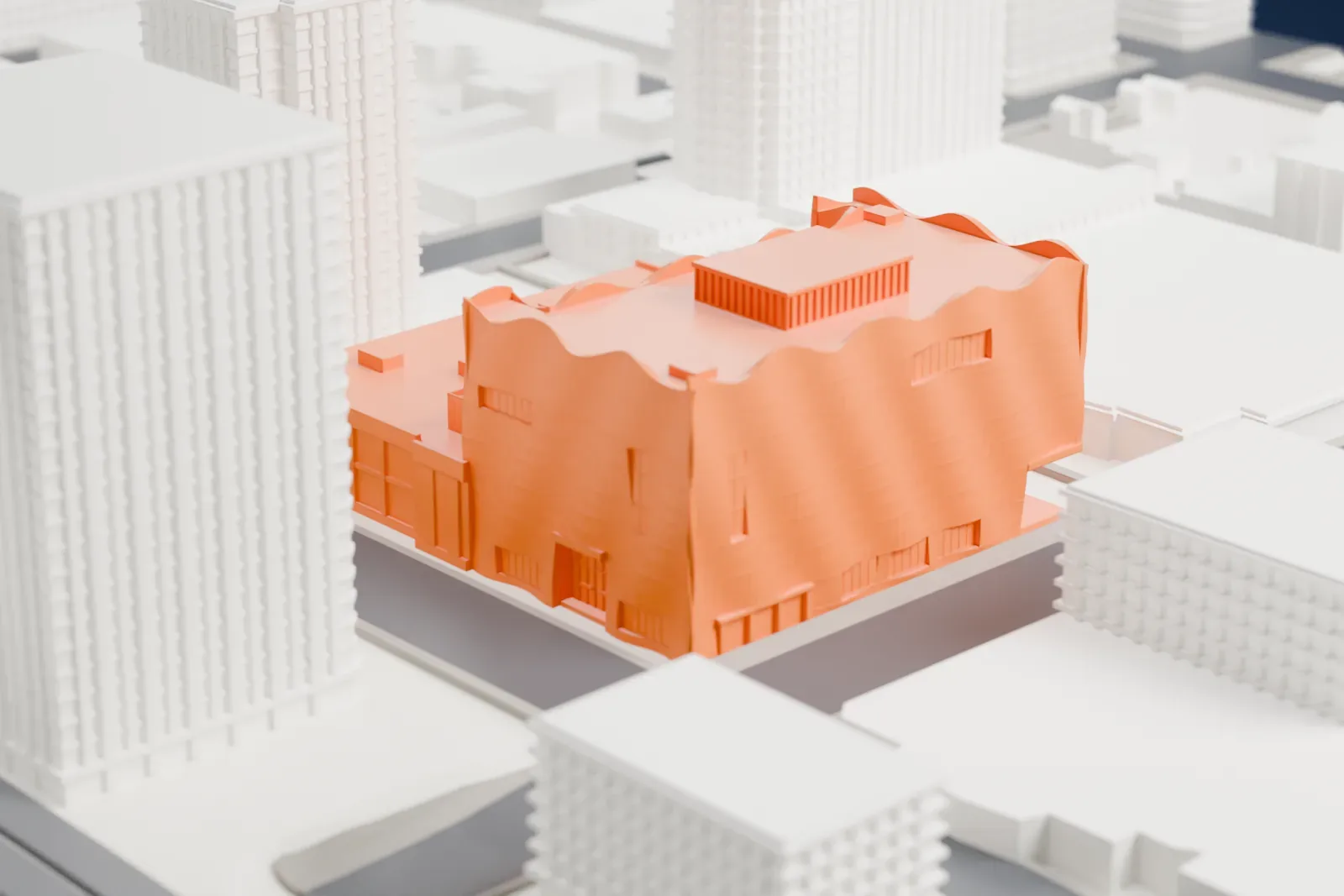 A white 3D print of the Glenbow Museum building among the surrounding streets and buildings of downtown Calgary.