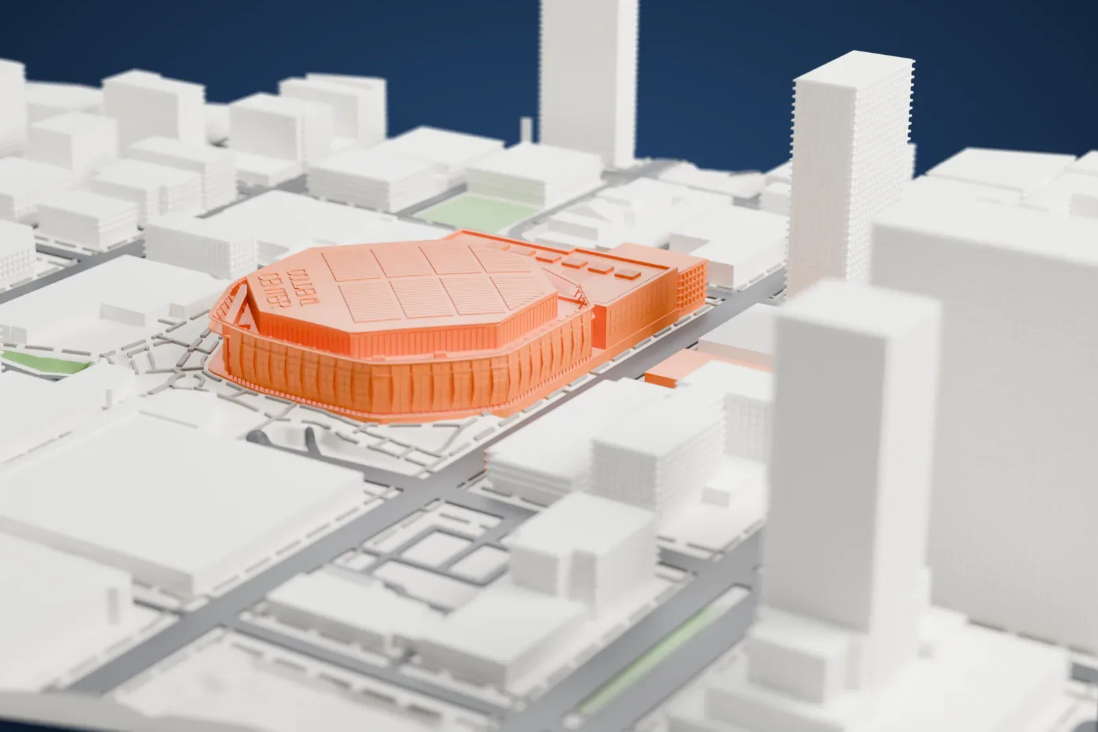 A white 3D print of Golden 1 Center, a many-sided arena with a ribbed outer wall and raised lettering on its roof, surrounded by city blocks, streets and a tall tower.