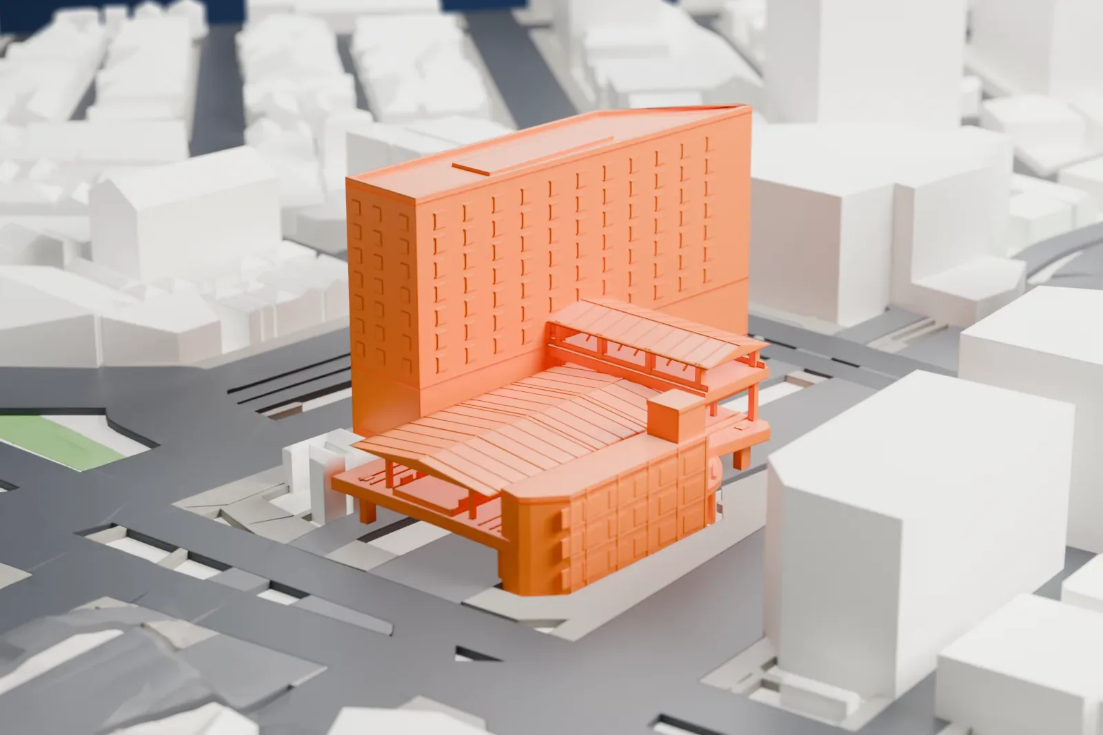 A white 3D print of Gotanda Station among surrounding streets and buildings.