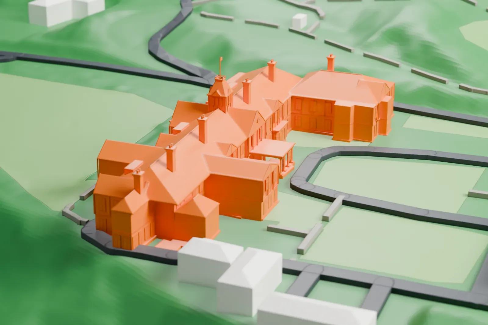 A white 3D print of Government House in Wellington, a long, many-gabled house with chimneys and a small tower, on green lawns and slopes with roads looping around it.