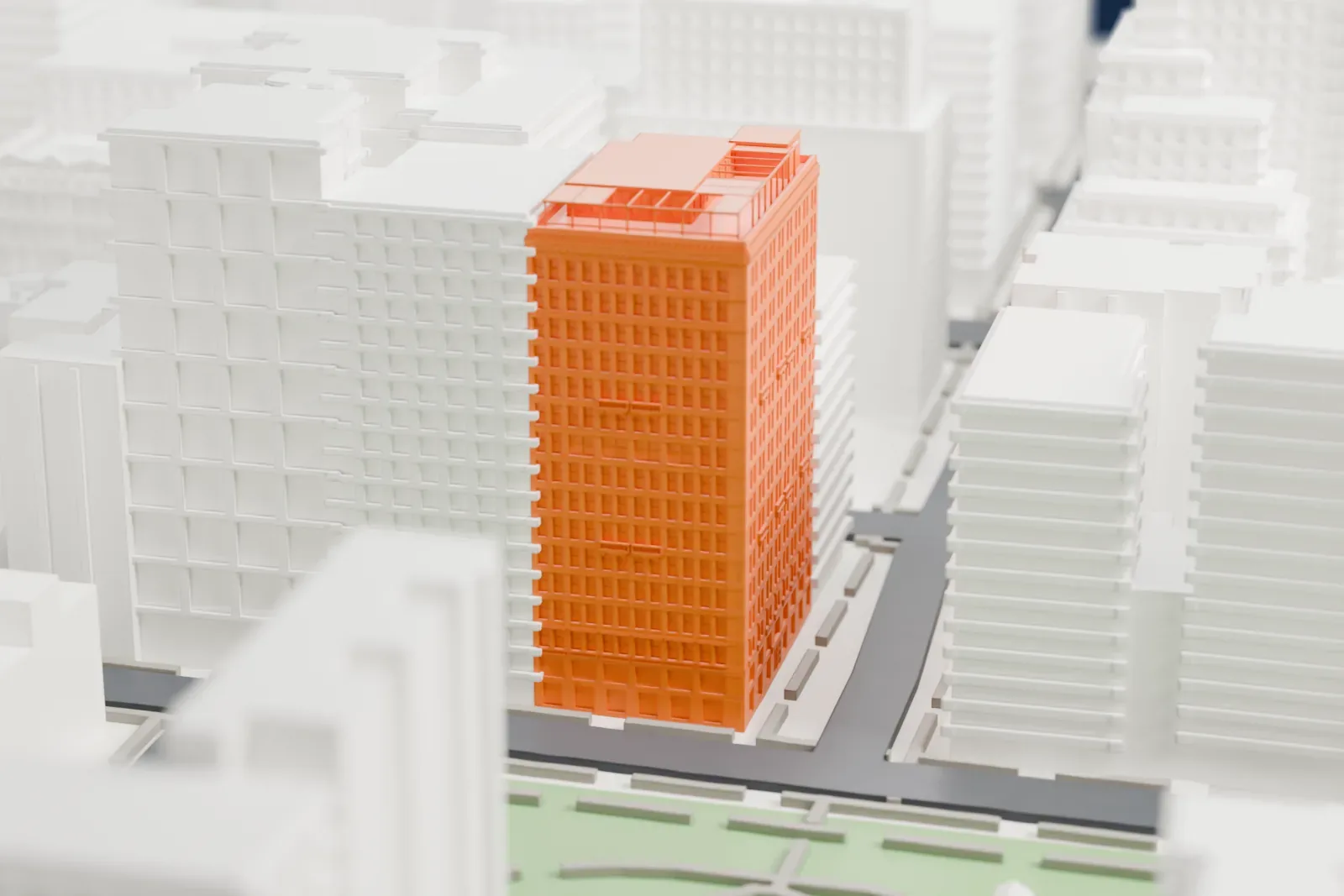A white 3D print of the Gramercy Park Hotel, a tall block with rows of windows and a busy roofline, among lower buildings and a park corner.