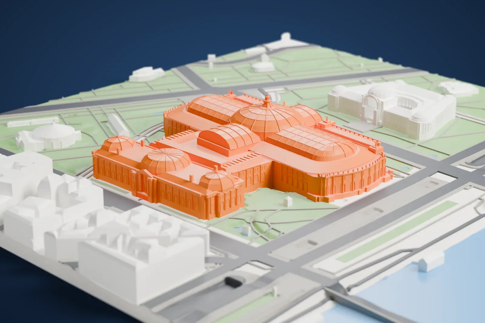 A white 3D print of the Grand Palais, a long exhibition hall under glass vaults, among the streets and buildings of Paris.