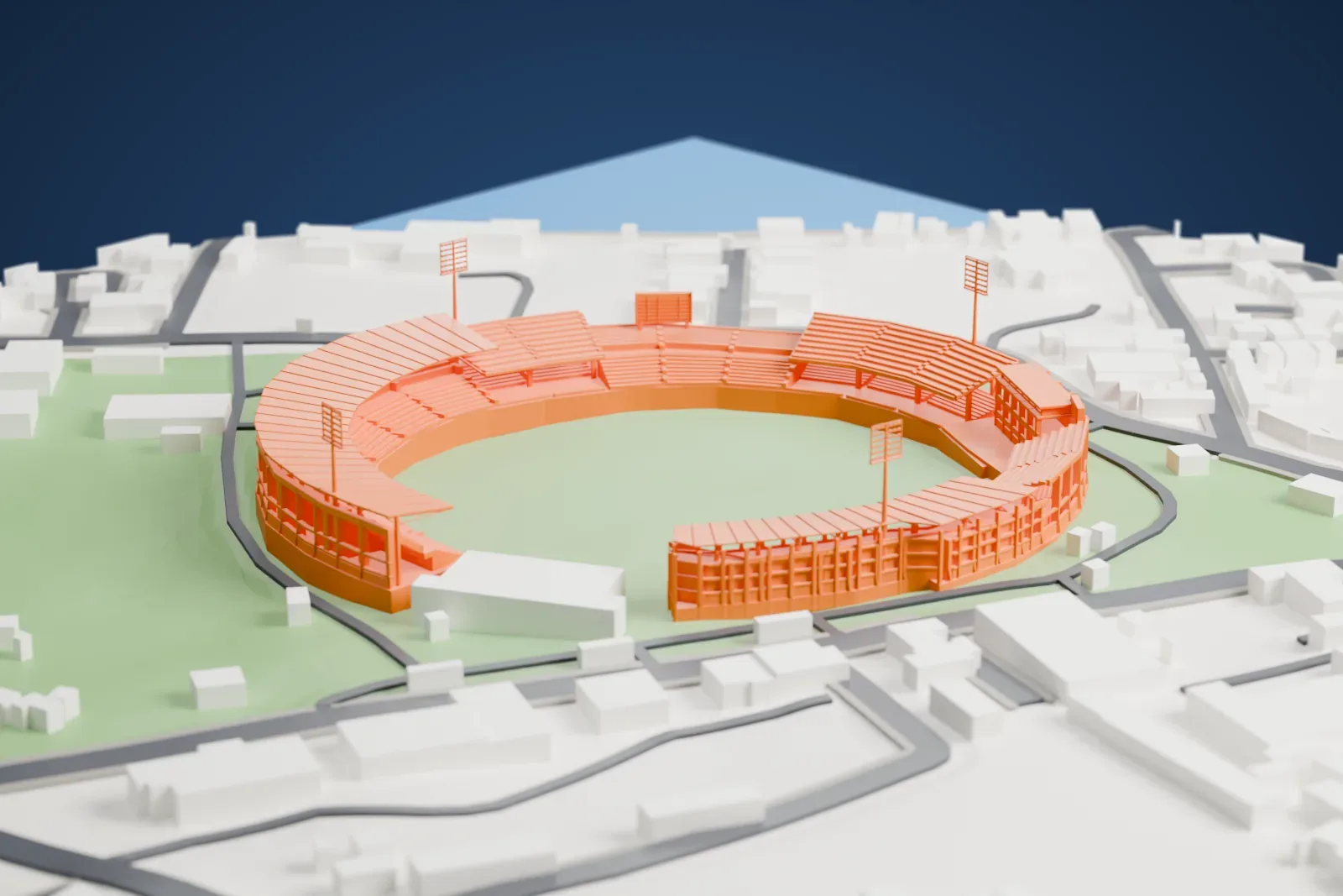 A white 3D print of Green Park Stadium in Kanpur, with its open cricket bowl, curved canopy and four light poles among the surrounding streets and buildings.