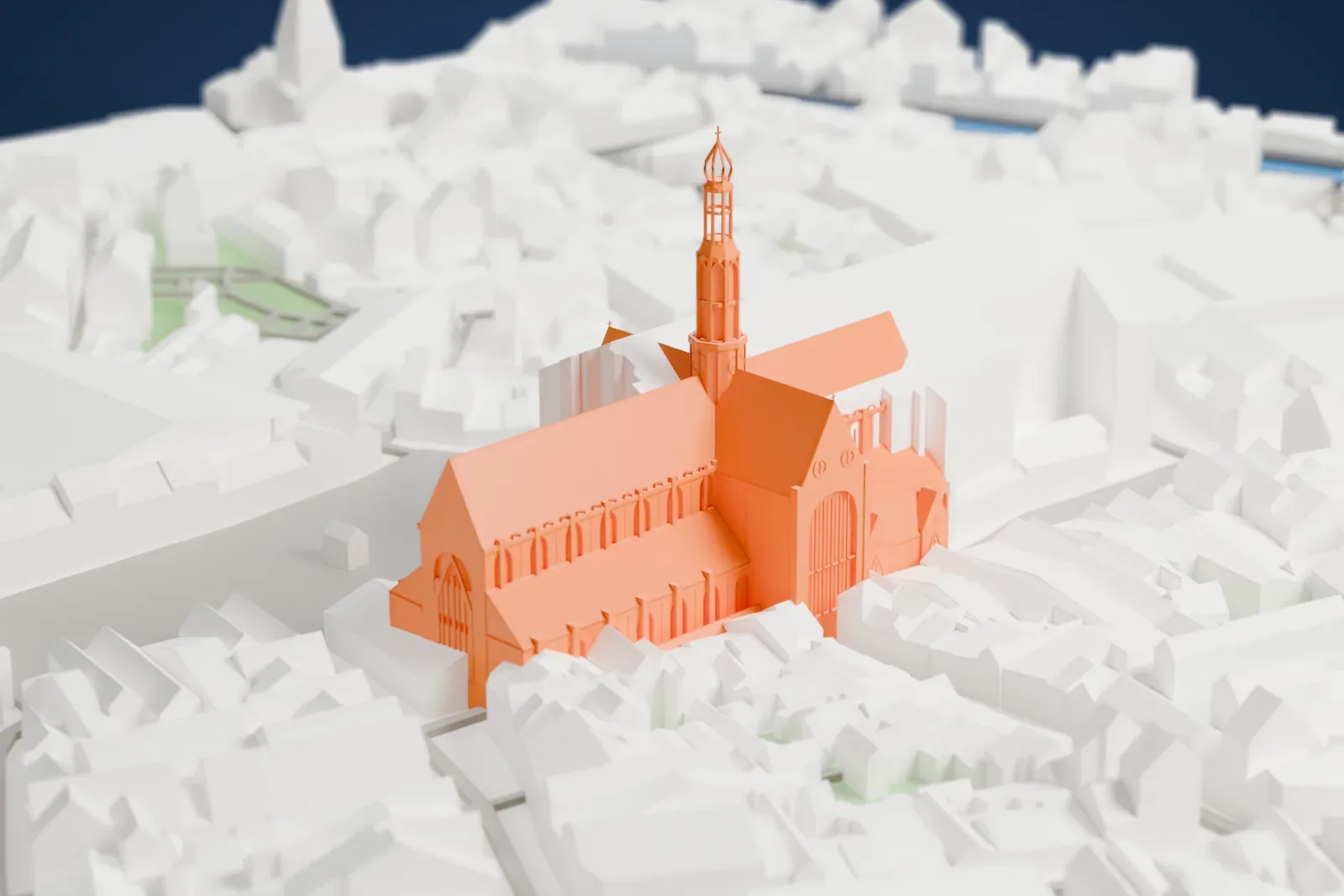 A white 3D print of the Grote Kerk in Haarlem among the surrounding streets and buildings.