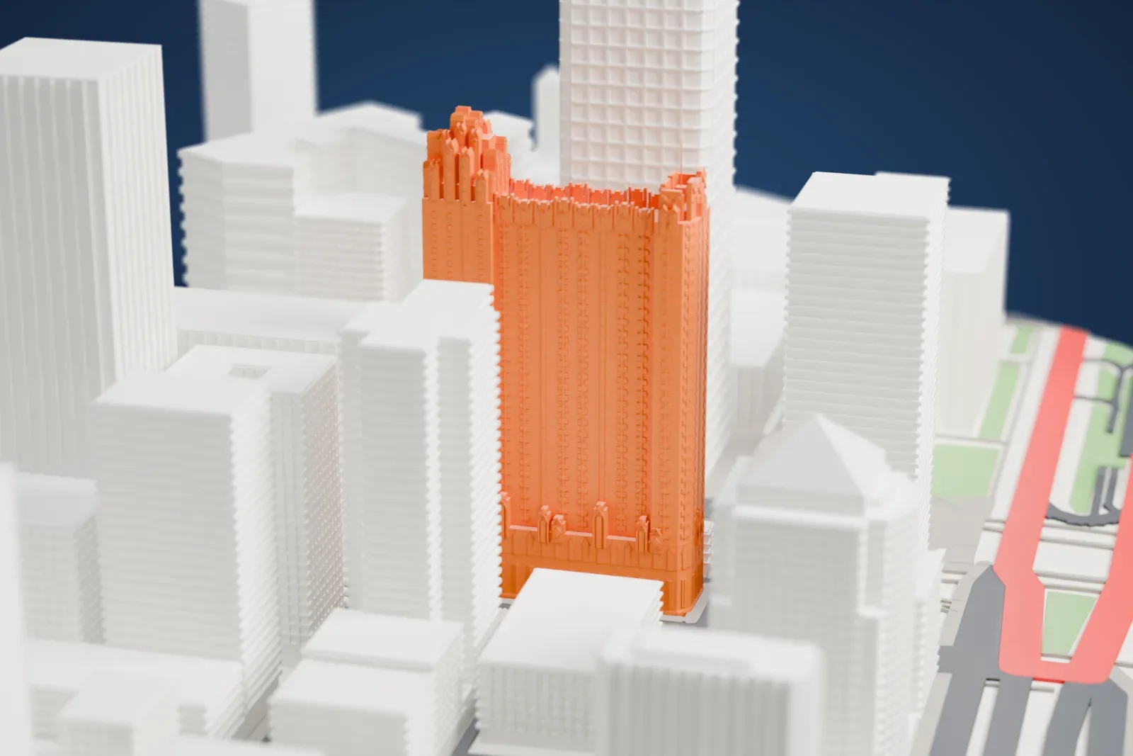 A white 3D print of the Guardian Building, with two unequal towers above a long masonry block, standing in the surrounding city.