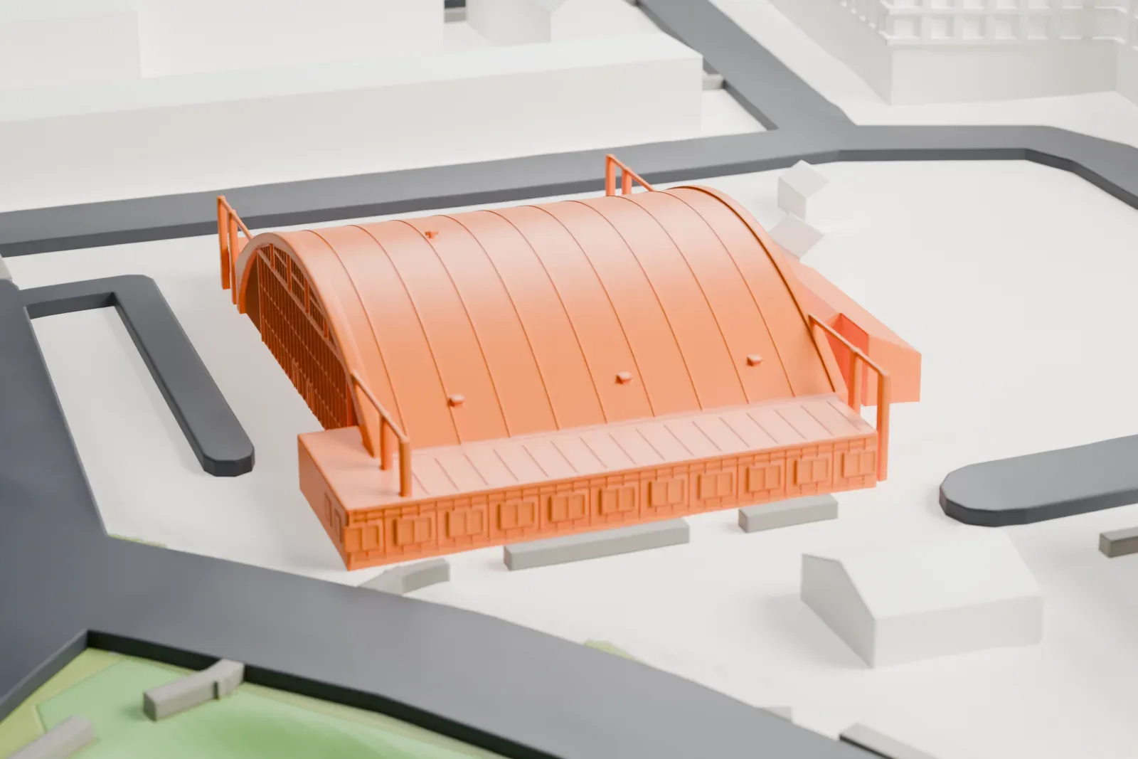 A white 3D print of Hangar H, a wide arched hangar with a ribbed roof and slim end posts, standing between long buildings and the water.
