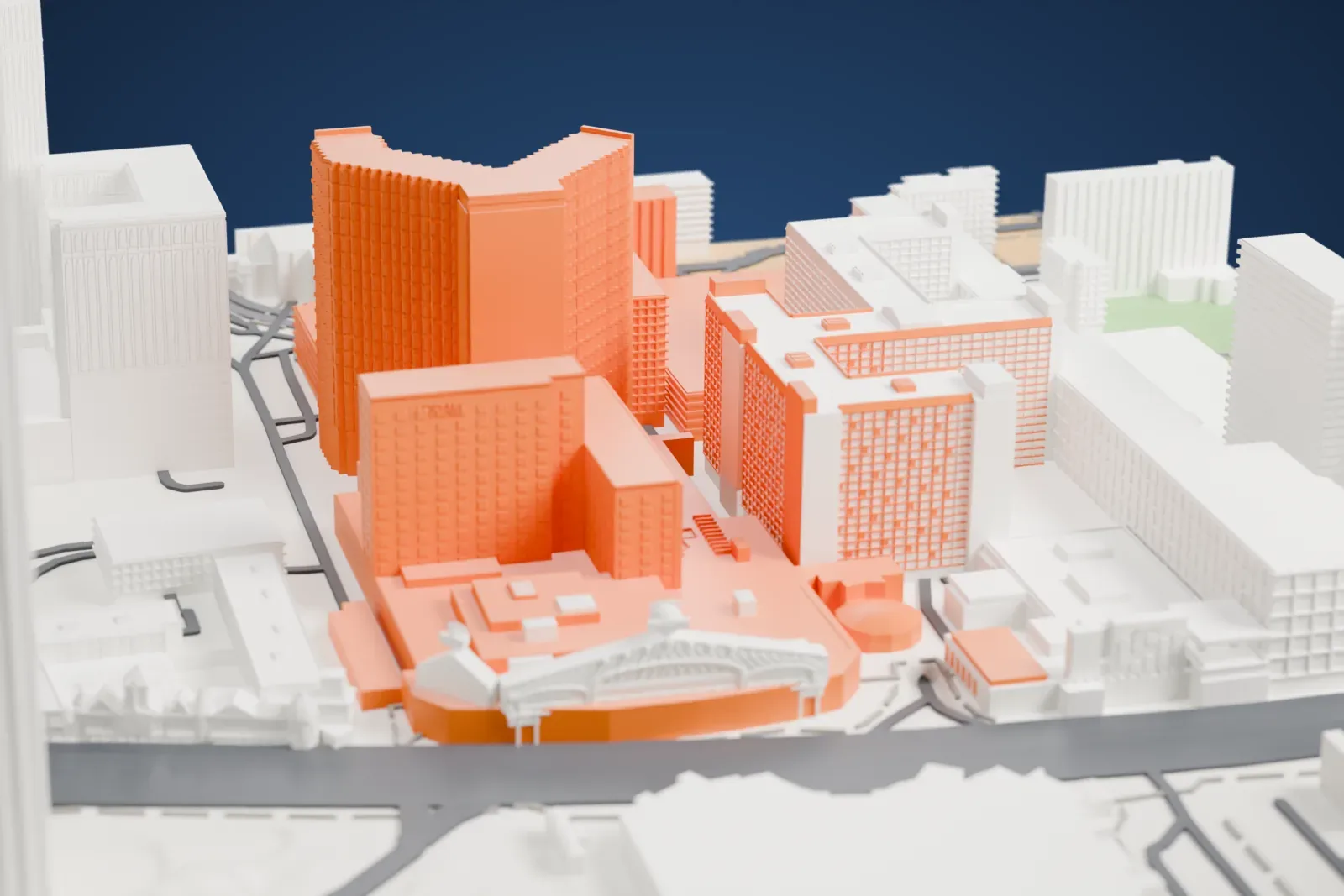 A white 3D print of Harrah's Las Vegas, a hotel tower with a notched top above a lower casino block, packed between neighboring buildings and a street.