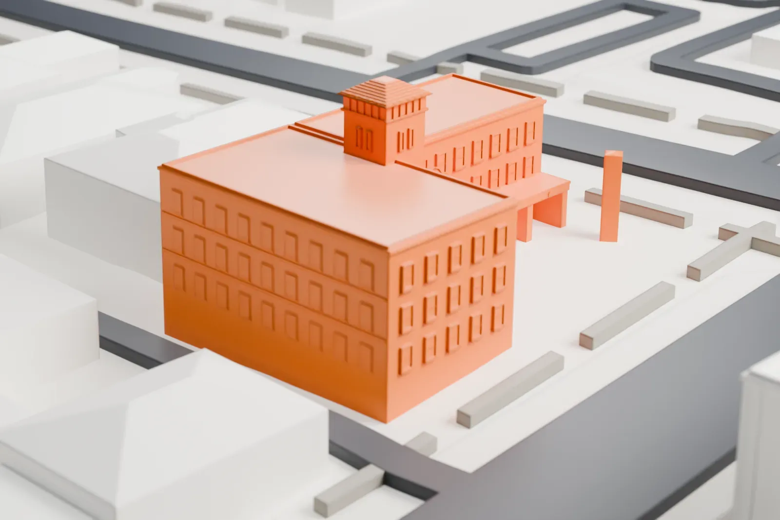 A white 3D print of the Hassayampa Inn, a wide, rectangular hotel with a small stepped tower and a slim entrance canopy, among low city blocks and streets.