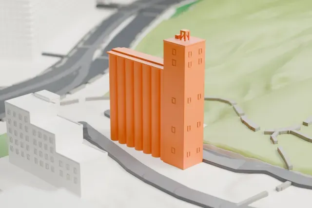 A white 3D print of the Hayden Flour Mill model in Tempe, with the streets around it.