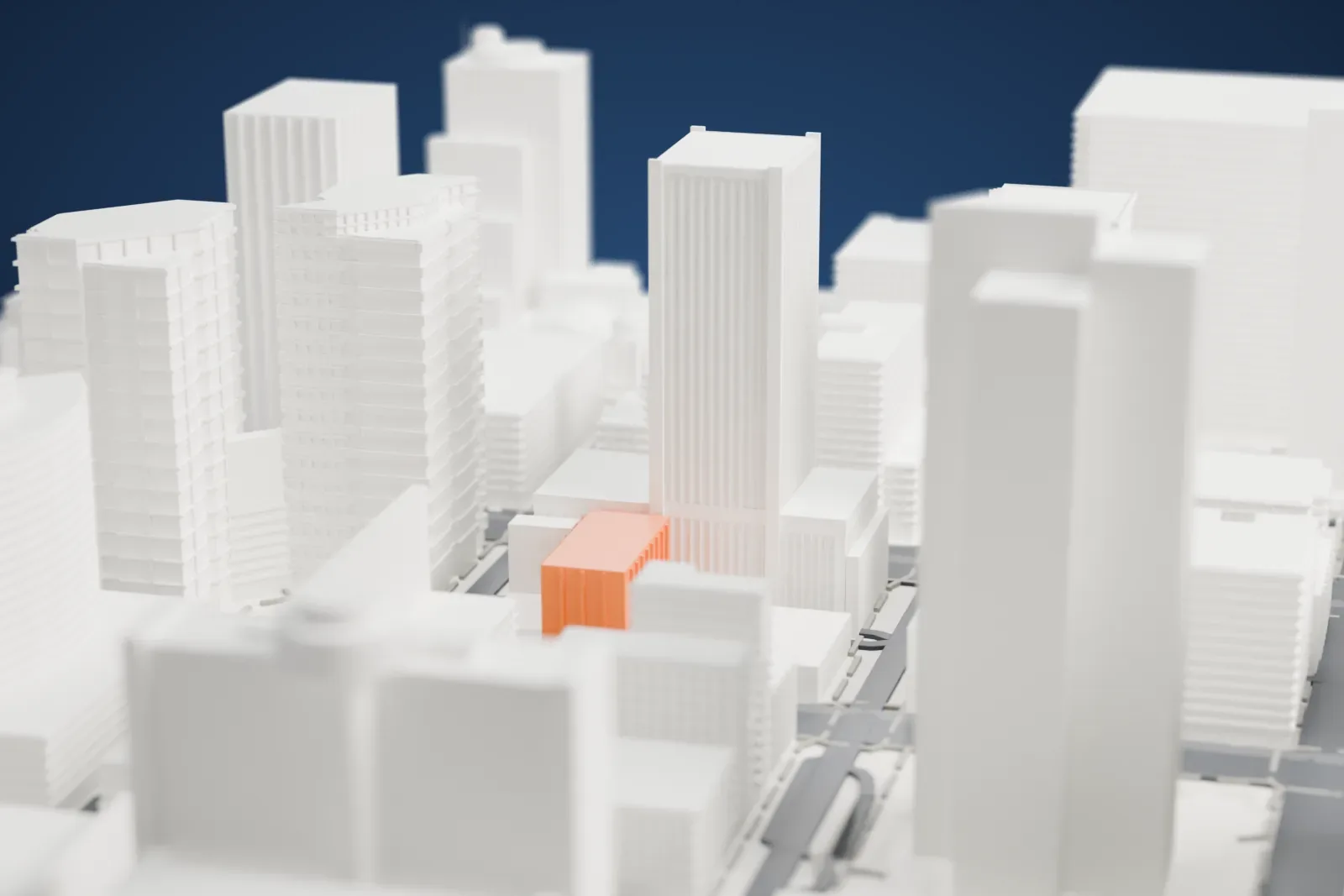 A white 3D print of the Heard Building, a mid-rise block with a flat roof and zigzag stairs on its side wall, hemmed in by larger neighboring buildings.