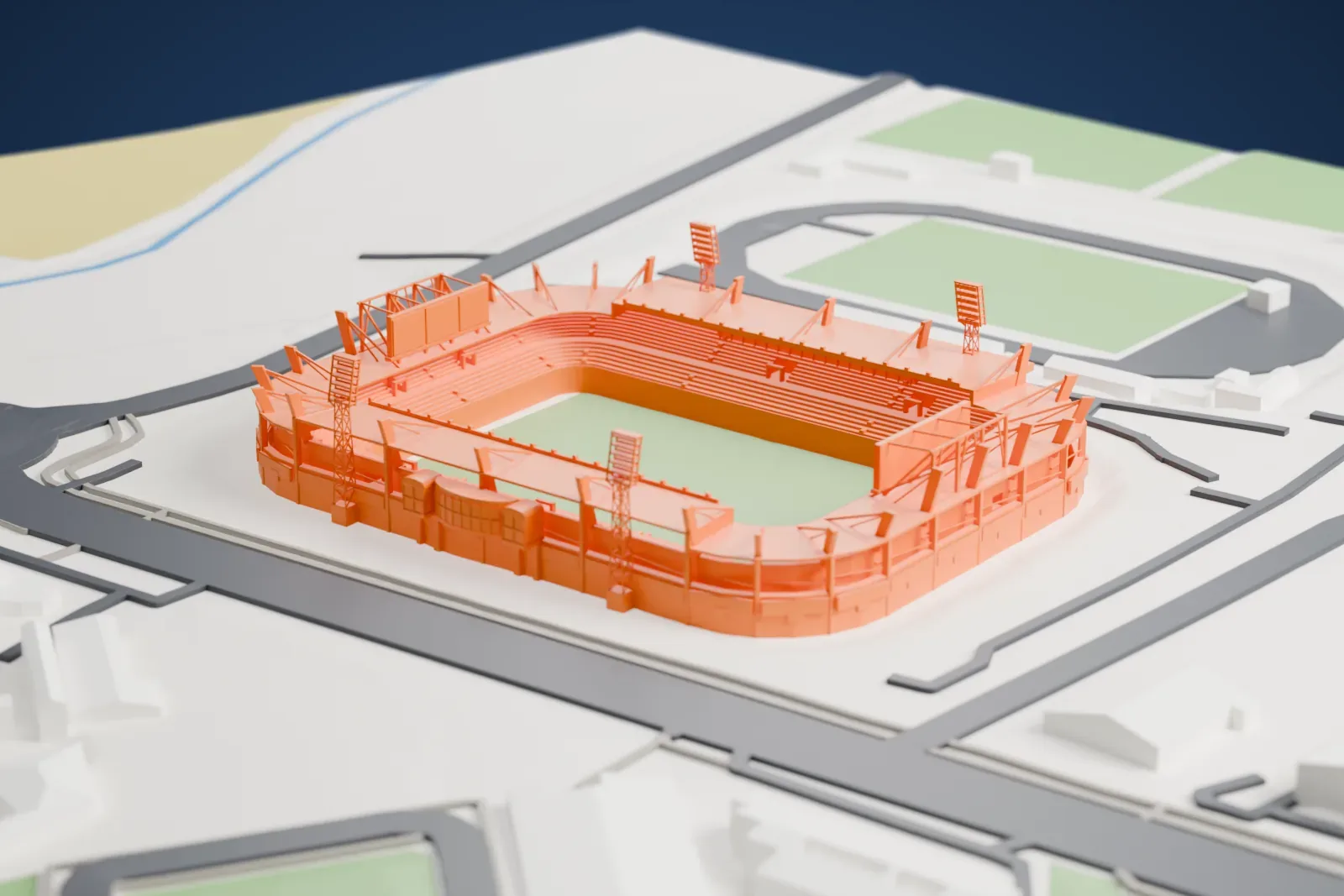 A white 3D print of the Helmántico Stadium, a football stadium with slanted roof struts and large screens, among surrounding roads and buildings.