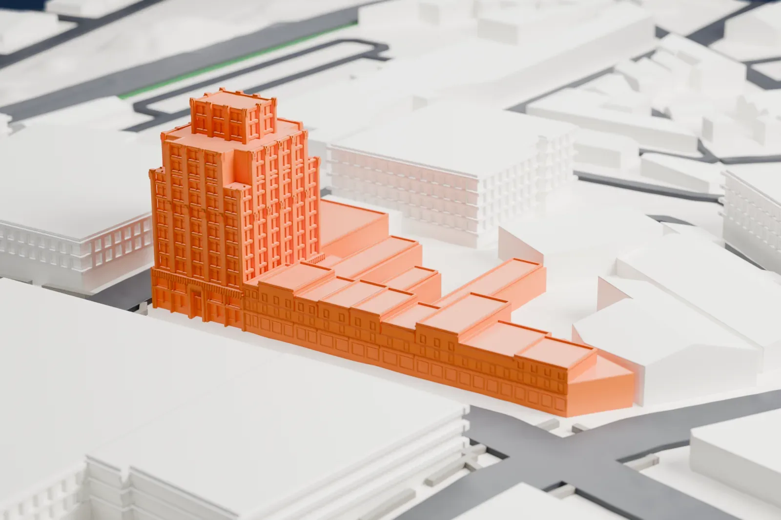 A white 3D print of Hersch Tower, a tall tower with a stepped crown and a long low row of buildings at its base, surrounded by wide streets and mid-rise buildings.