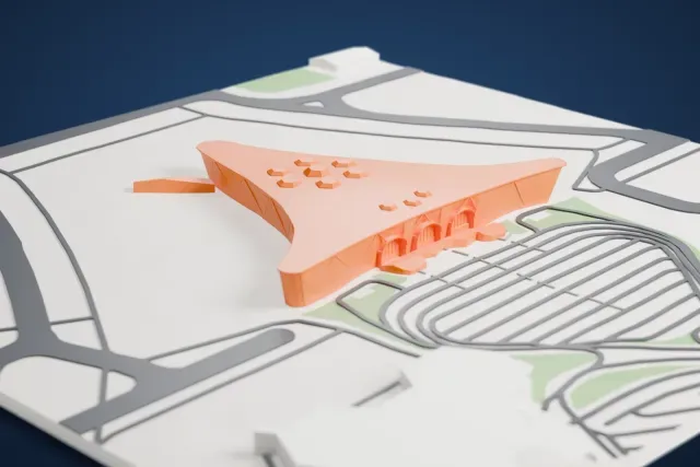 A white 3D print of the Heydar Aliyev International Airport Terminal 1 model in Baku, with the streets around it.