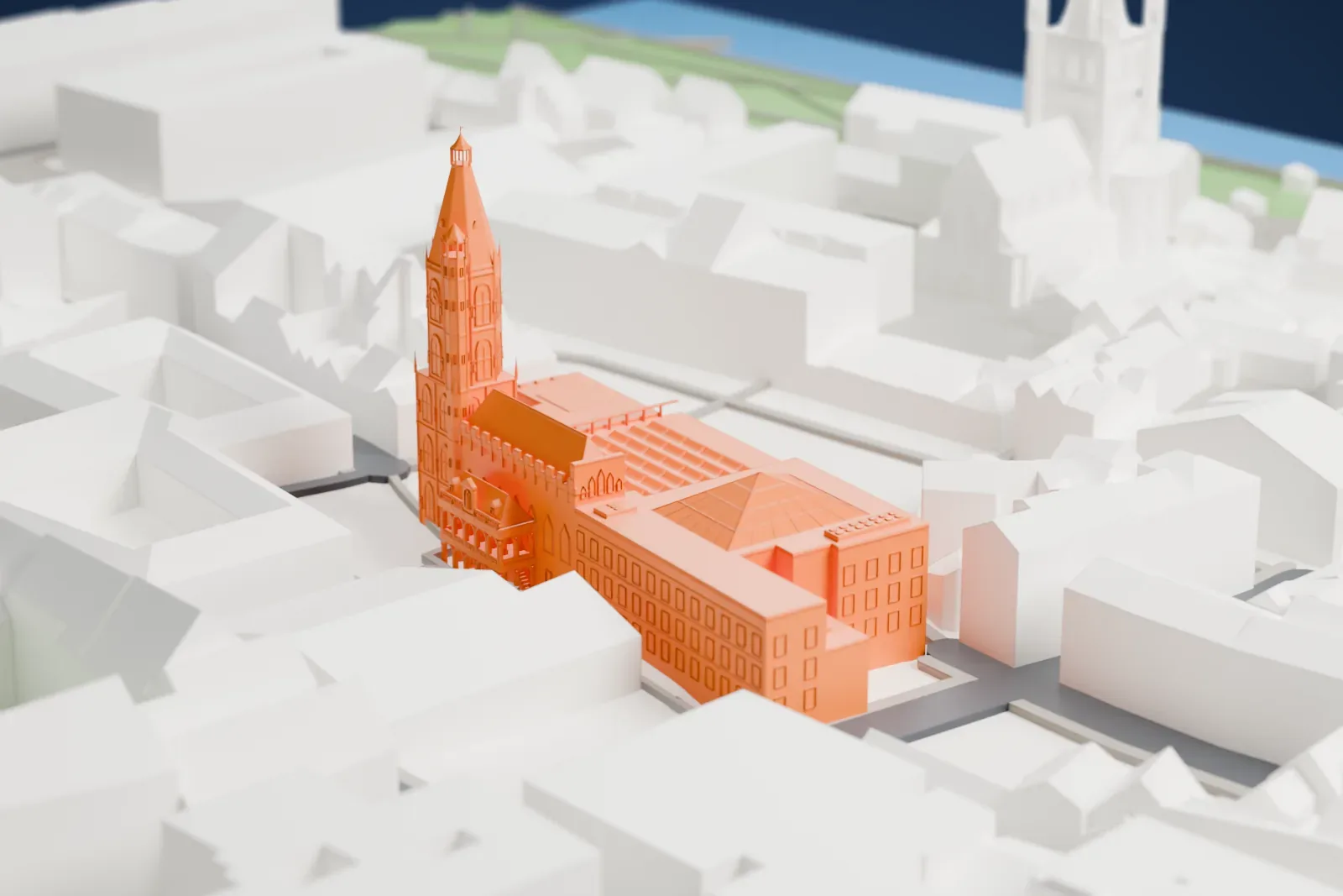 A white 3D print of the Historic City Hall in Cologne, a complex of buildings, among the surrounding streets and buildings.