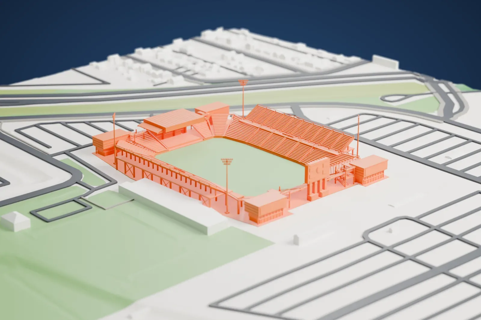 A white 3D print of Historic Crew Stadium, with its open bowl, high sideline decks and stage canopy, among surrounding streets and buildings.