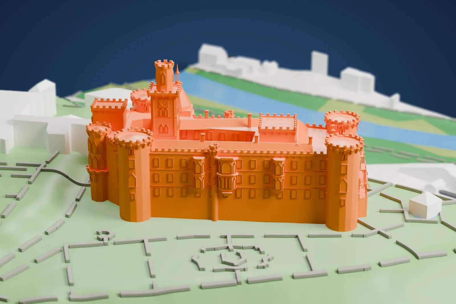A white 3D print of Hluboká Castle, a battlemented castle with round corner towers, a tall tower and a pointed turret, standing on a green hillside with paths and a few buildings nearby.