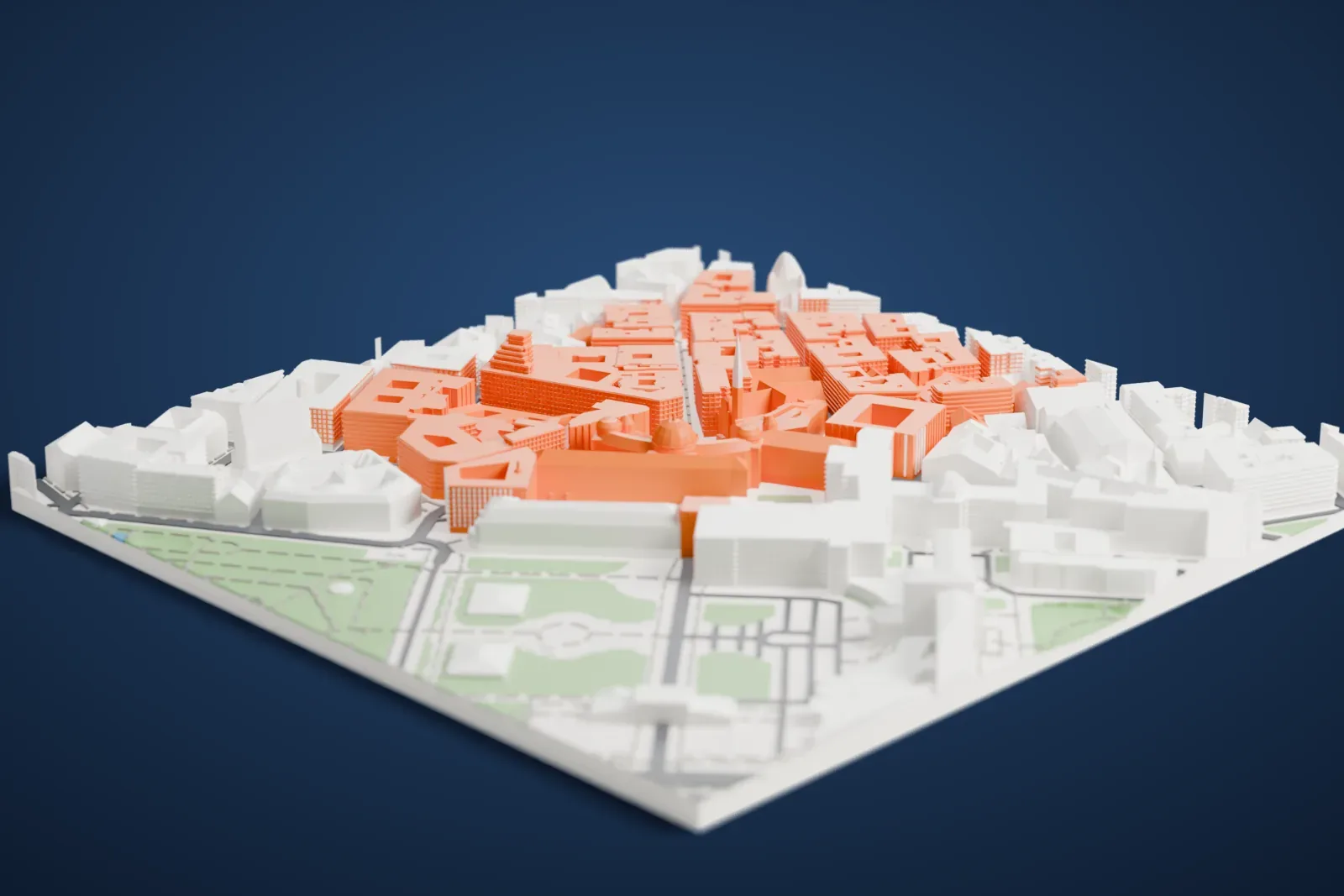 A white 3D print of the Hofburg, a curved palace wing topped with a large ribbed dome and several smaller domes, surrounded by tightly packed city buildings and courtyard blocks.
