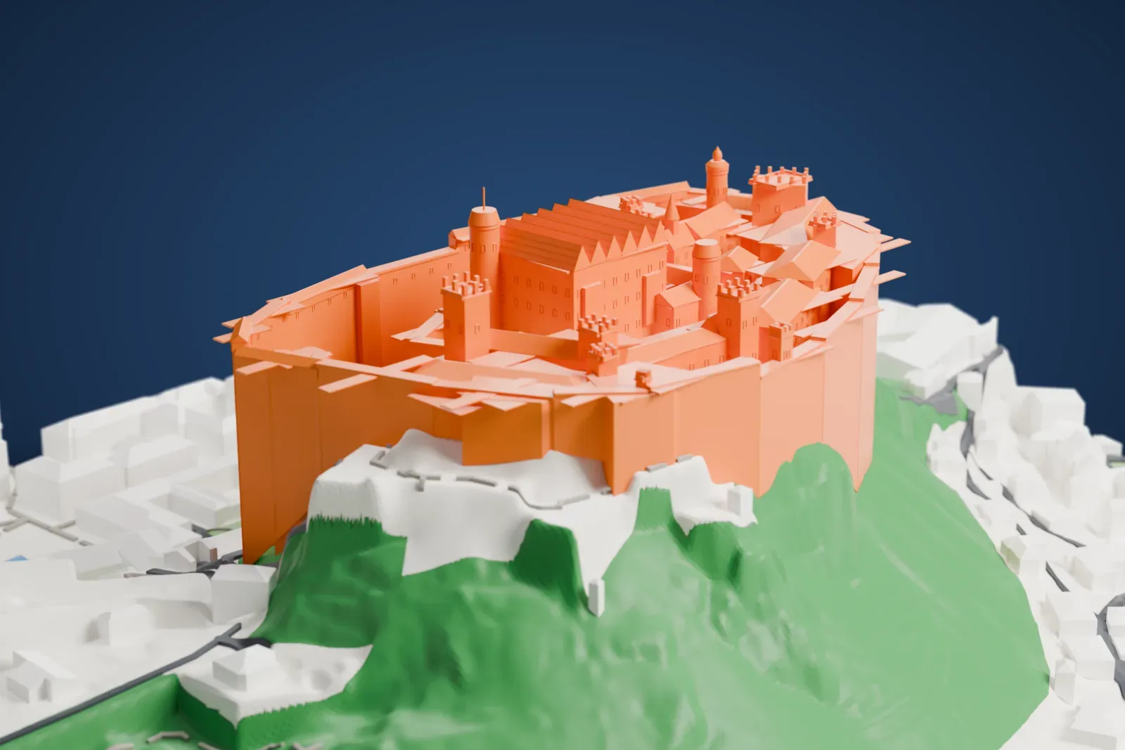 A white 3D print of Hohensalzburg Fortress, a large walled castle with towers and steep roofs on a green hilltop above the rooftops of Salzburg.