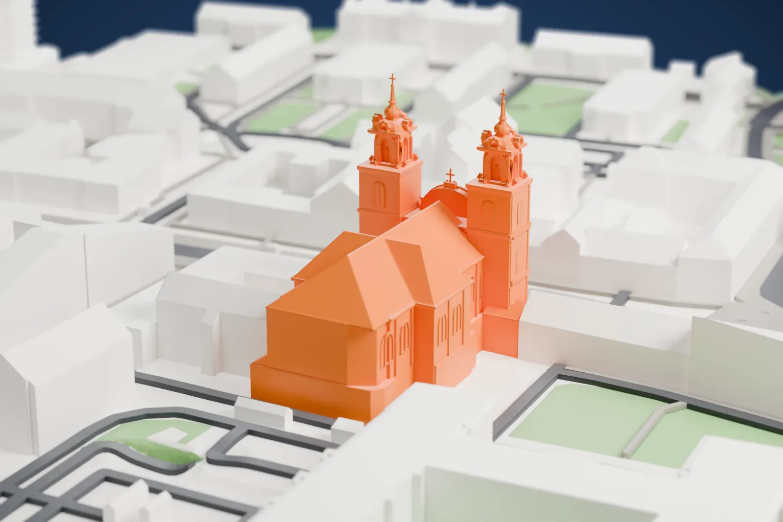 A white 3D print of the Holy Cross Church in Warsaw among the surrounding streets and buildings of the city center.