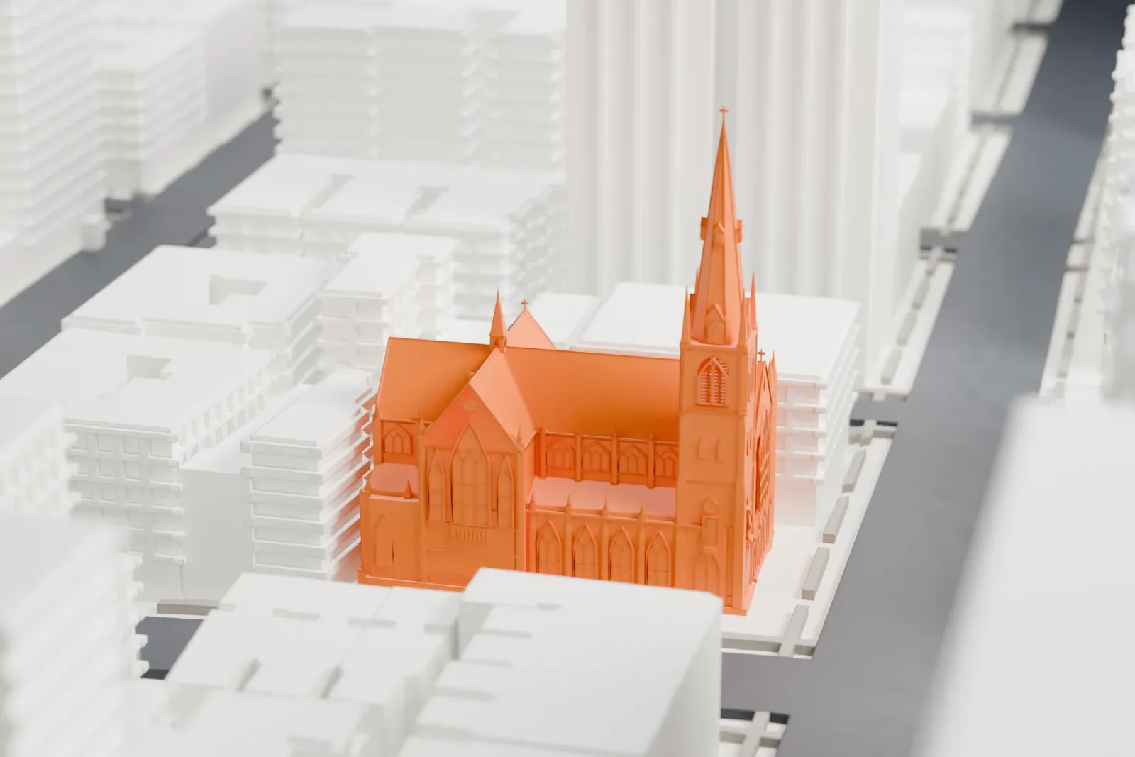 A white 3D print of Holy Name of Jesus Roman Catholic Church, a Gothic church with a tall steeple and steep roofs, surrounded by tall buildings and streets.