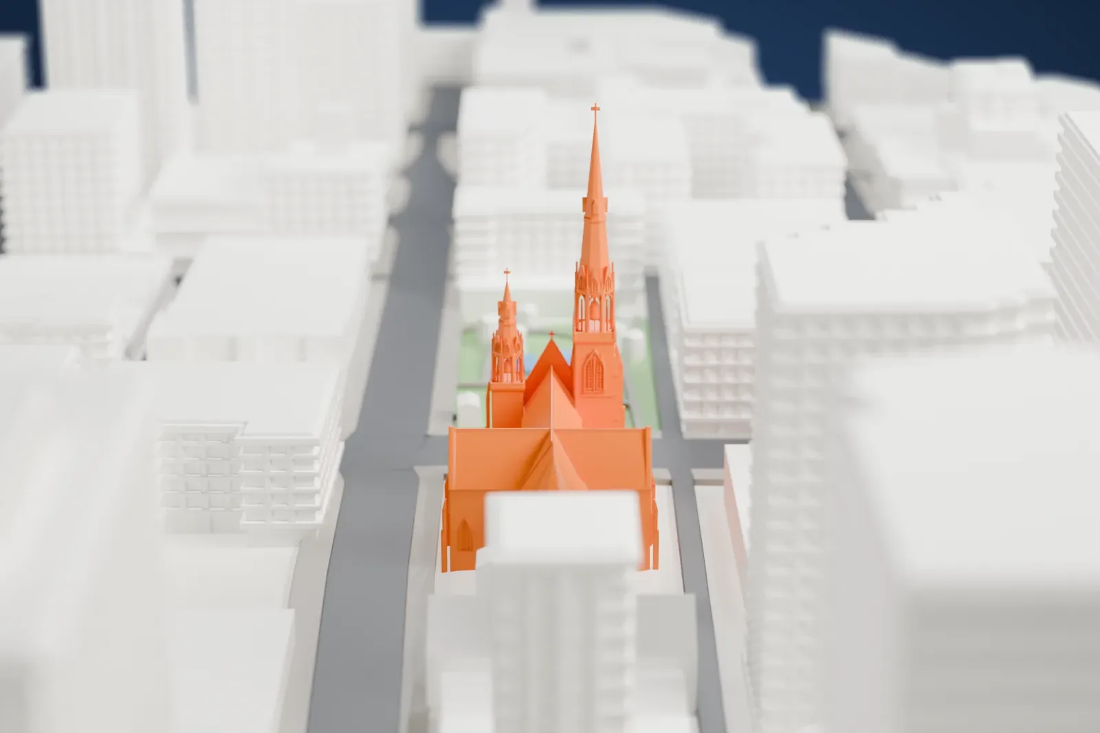 A white 3D print of the Holy Rosary Cathedral among the surrounding streets and buildings.