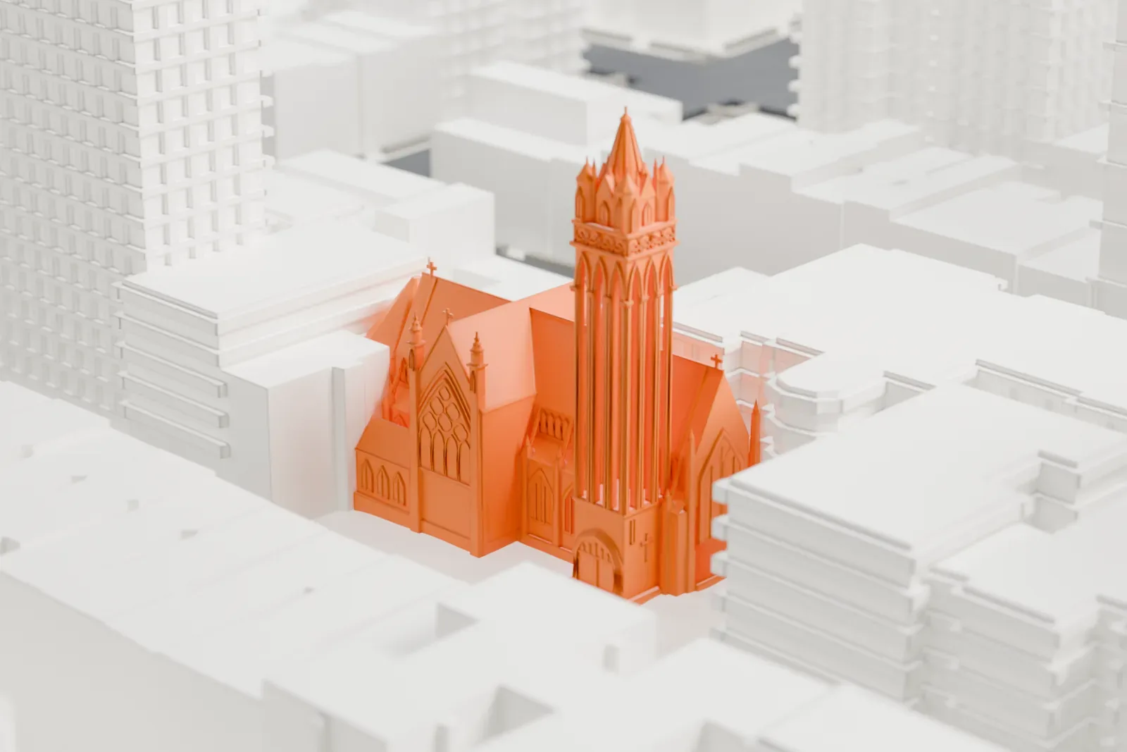 A white 3D print of Holy Trinity Church, a church with a tall pinnacled tower and steep roofs, among taller buildings.