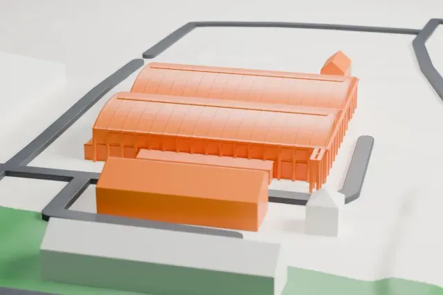 A white 3D print of the Hooton Park Hangar 1 model in Liverpool, with the streets around it.