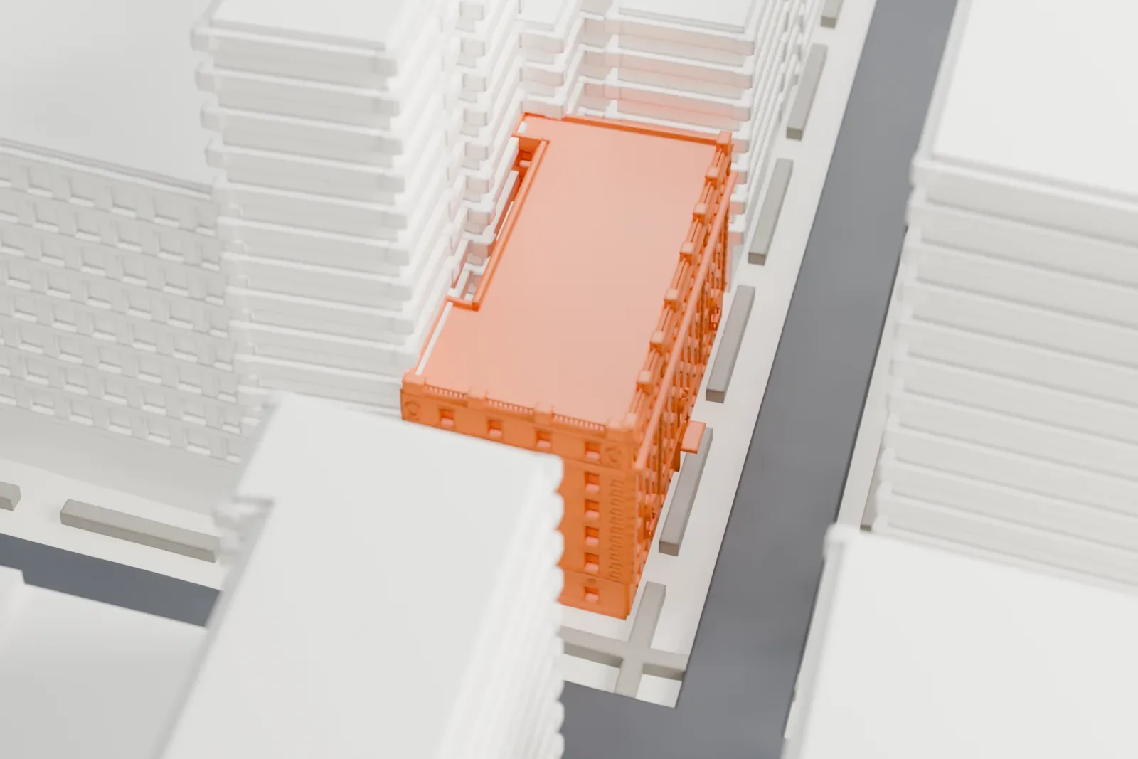 A white 3D print of Hotel Albert, a narrow building with a decorated top edge, set between taller buildings.