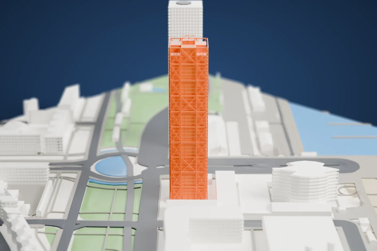 A white 3D print of Hotel Arts, a slender tower with an exposed steel frame and open top corners, standing among the surrounding city buildings.