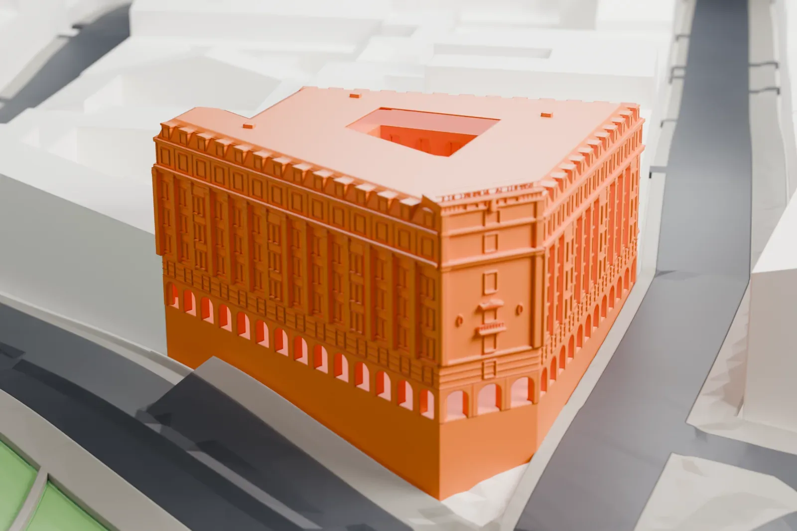 A white 3D print of the Hotel Astoria, a multi-story hotel building, among the surrounding streets and buildings of Saint Petersburg.