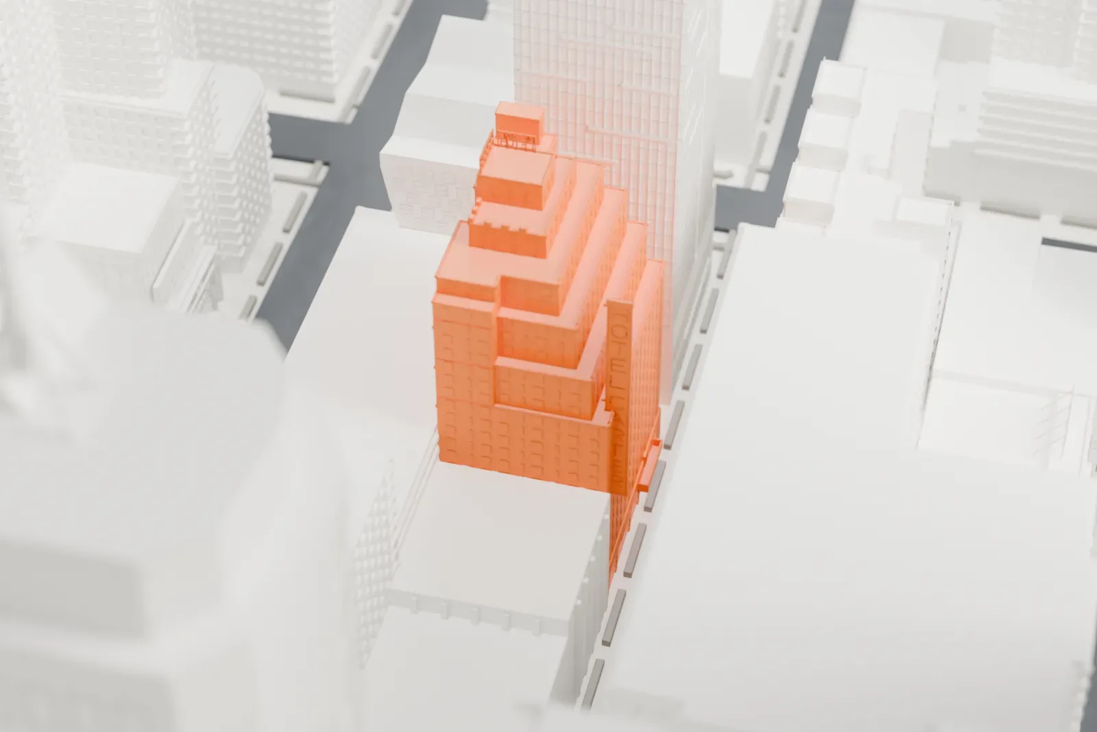 A white 3D print of the Hotel Carter, a tall stepped building surrounded by skyscrapers near Times Square.