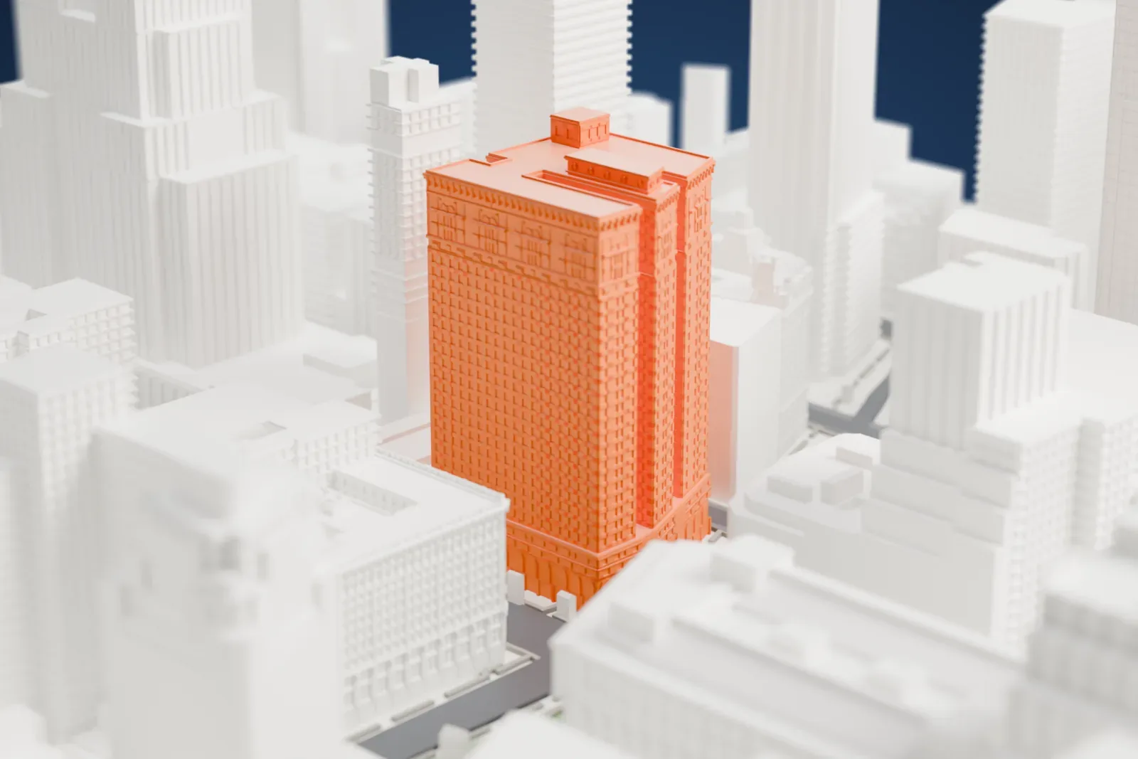 A white 3D print of Hotel McAlpin, a tall block with three wings and a detailed roofline, standing among other skyscrapers.