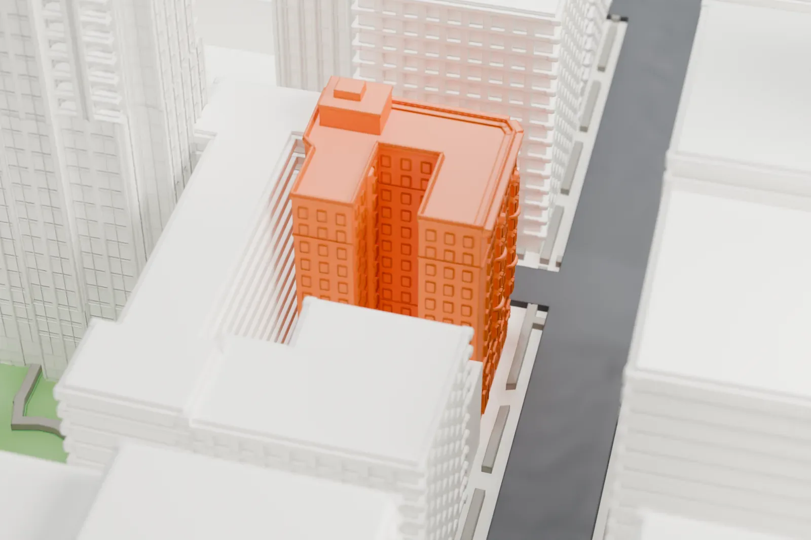 A white 3D print of the Hotel Seville NoMad, a mid-rise corner hotel set among taller buildings.