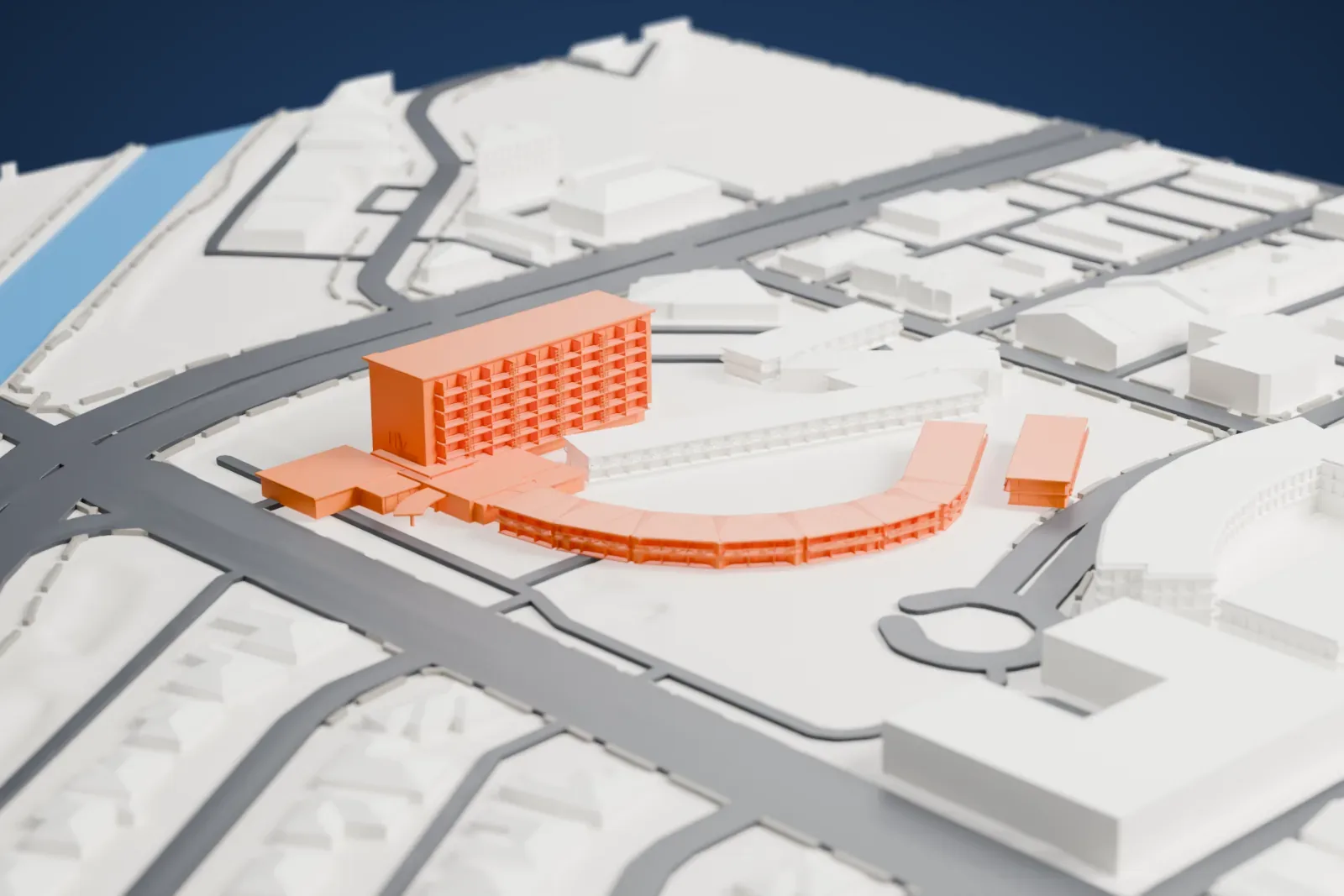 A white 3D print of Hotel Valley Ho, a tall block with long, low wings, one curving in an arc, standing on an open site among roads, a strip of water and small buildings.