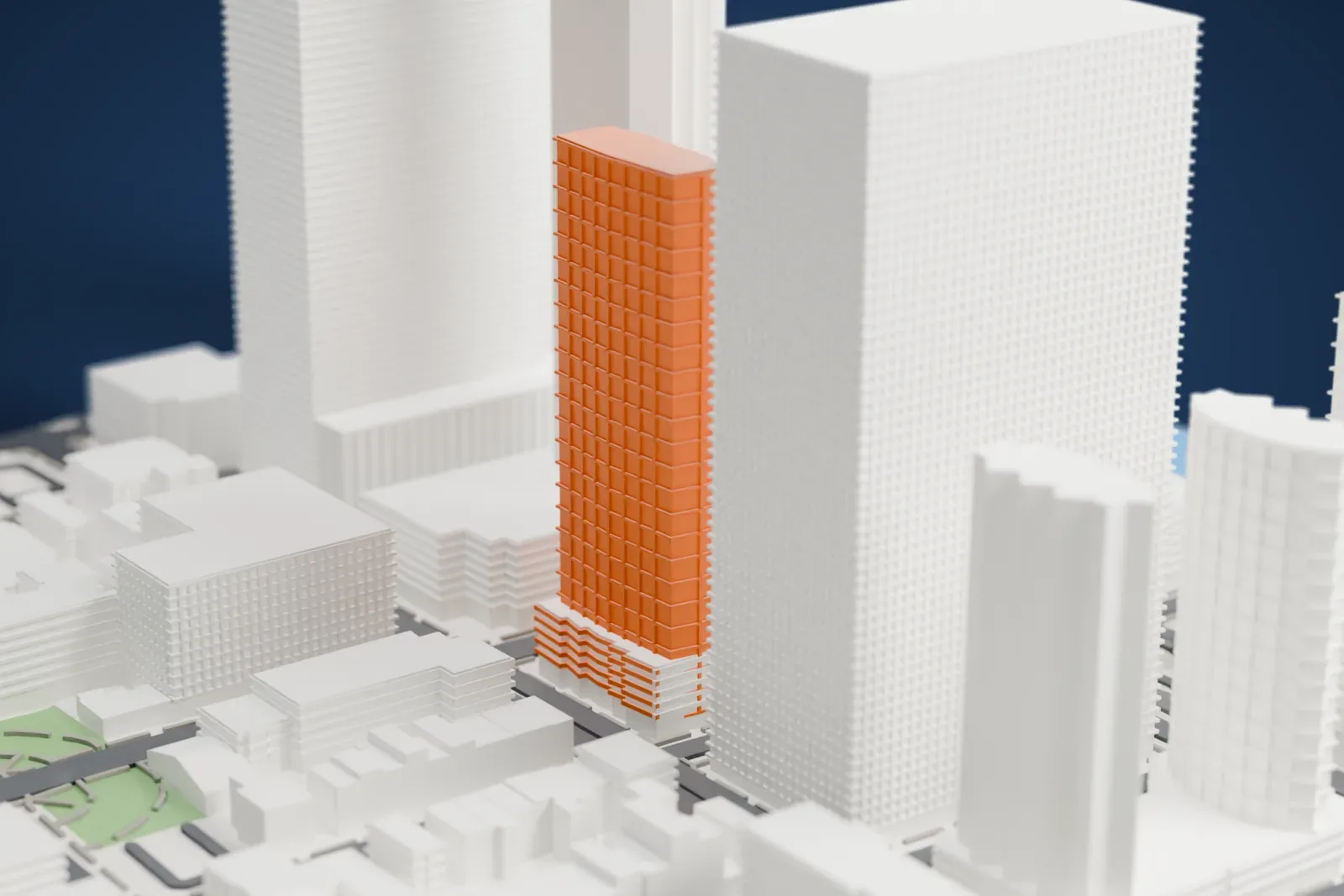 A white 3D print of Hudson Greene, two tall towers with stepped tops, surrounded by other high-rises and city streets.