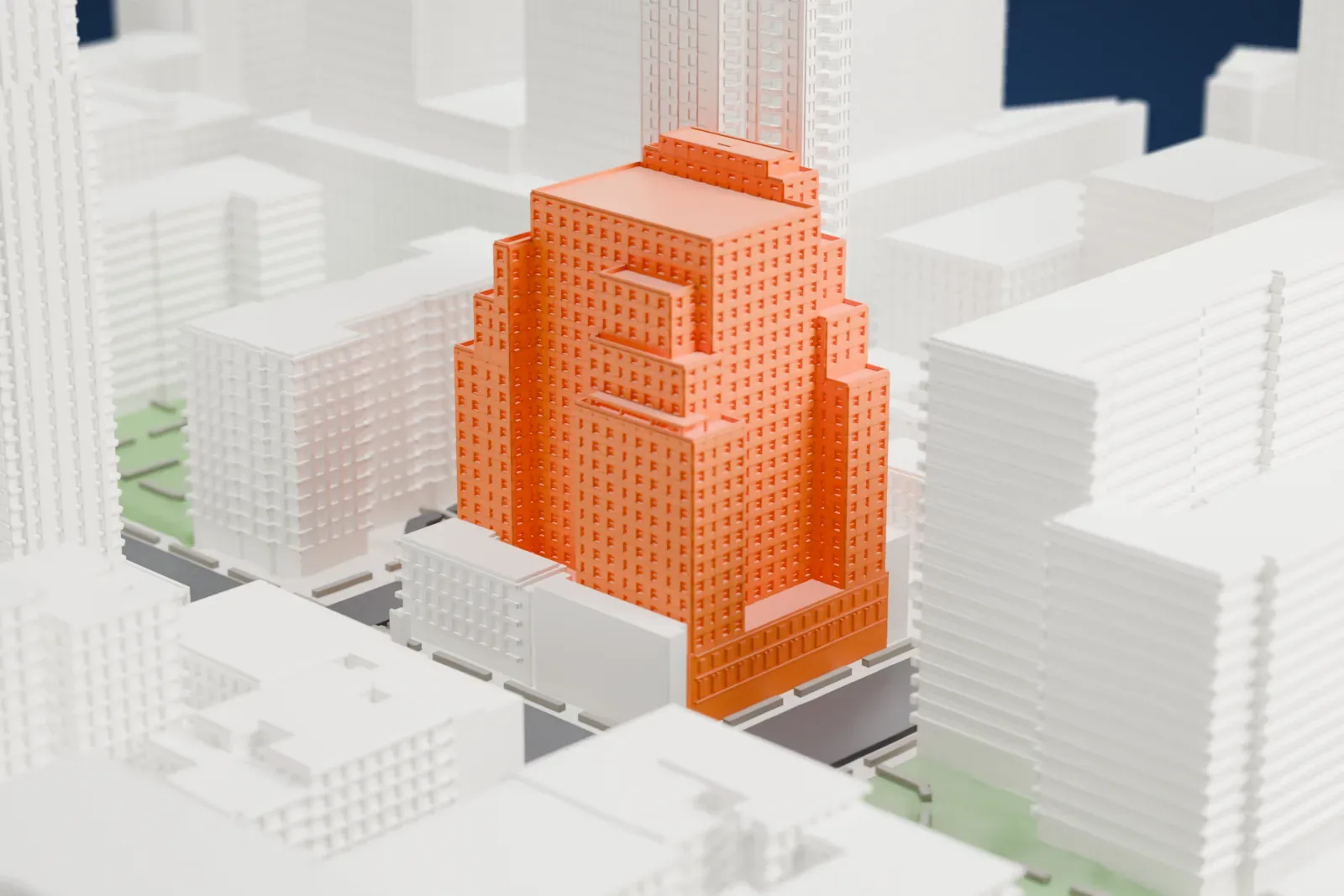 A white 3D print of the Hudson Hotel, a stepped tower with a grid of windows, standing among taller buildings and streets.