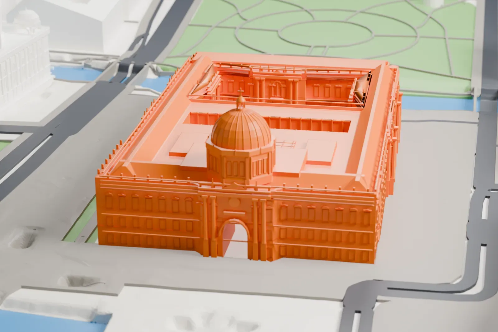 A white 3D print of the Humboldt Forum, a large museum building on Museum Island among the surrounding streets and buildings of Berlin.