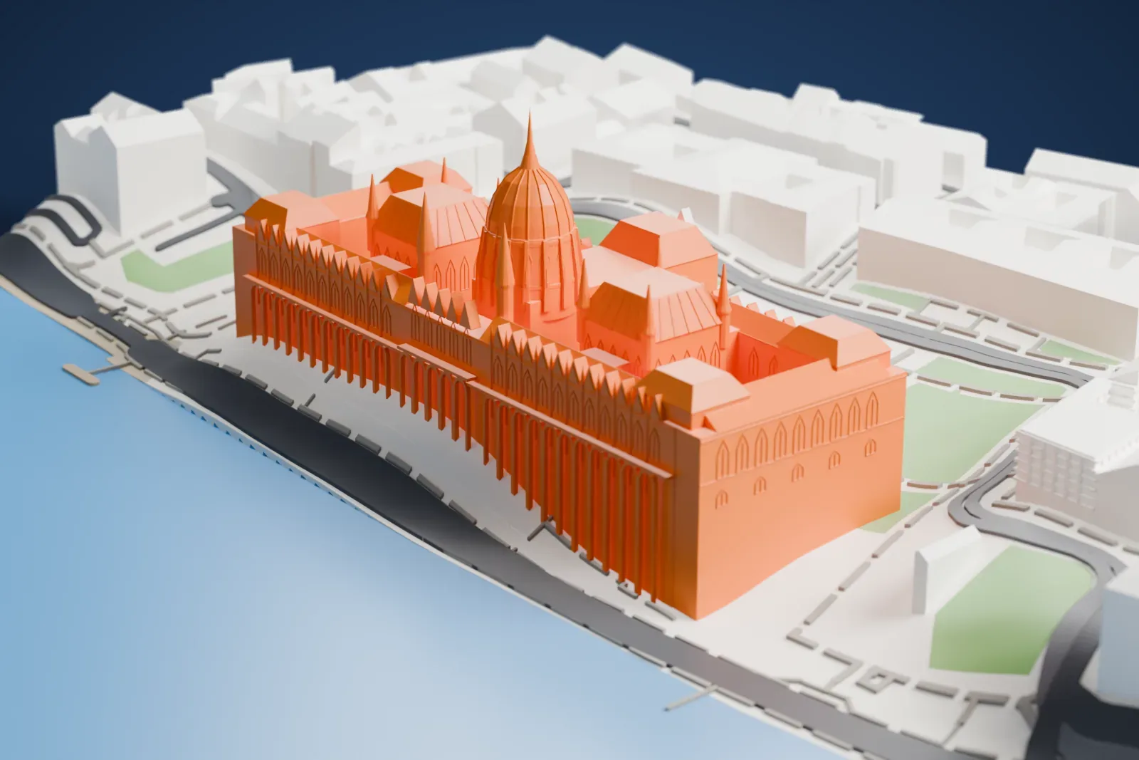 A white 3D print of the Hungarian Parliament Building, a long building with a central dome and many spires, standing beside a wide stretch of water with streets and a park behind it.