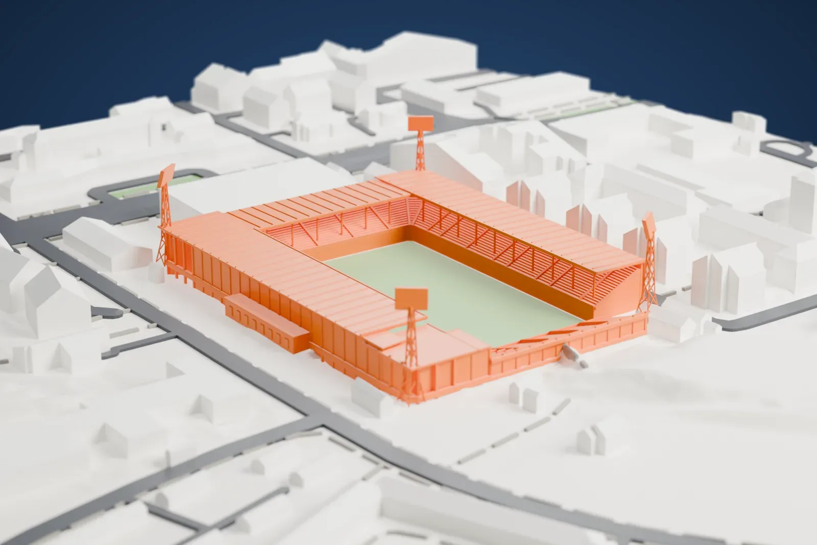A white 3D print of Idrottsparken, a tight rectangular football ground with flat roofs over three sides, an open terrace at the south end and a lattice floodlight mast at each corner, among the surrounding streets and buildings.
