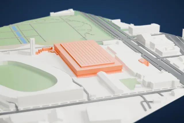 A white 3D print of Inalpi Arena, a wide, low arena with a grid of small roof details, beside an oval stadium with parkland and streets nearby.
