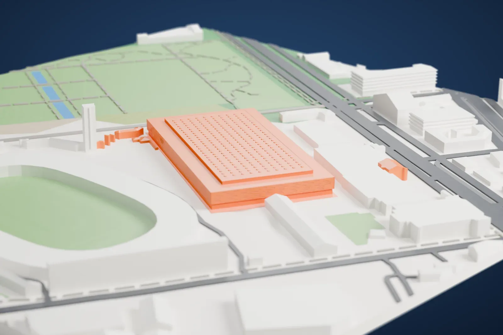 A white 3D print of Inalpi Arena, a wide, low arena with a grid of small roof details, beside an oval stadium with parkland and streets nearby.