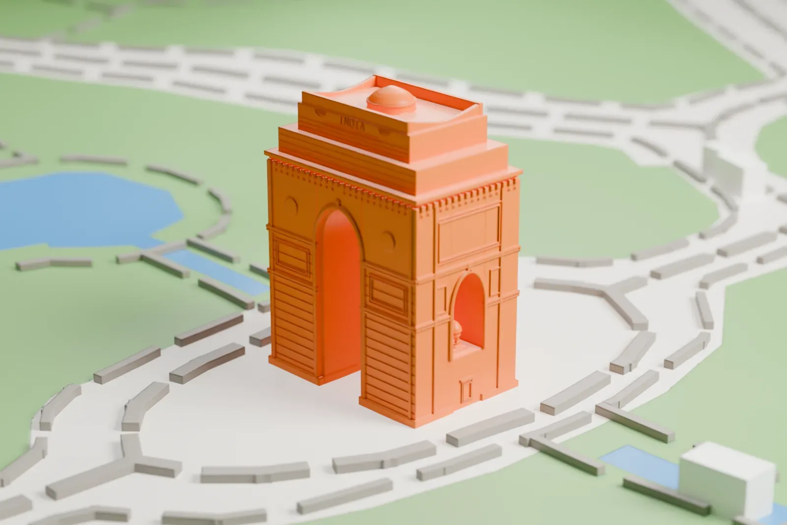A white 3D print of India Gate, a stepped stone arch with a shallow dome on top, standing in a circular plaza ringed by roads with lawns and water beyond.