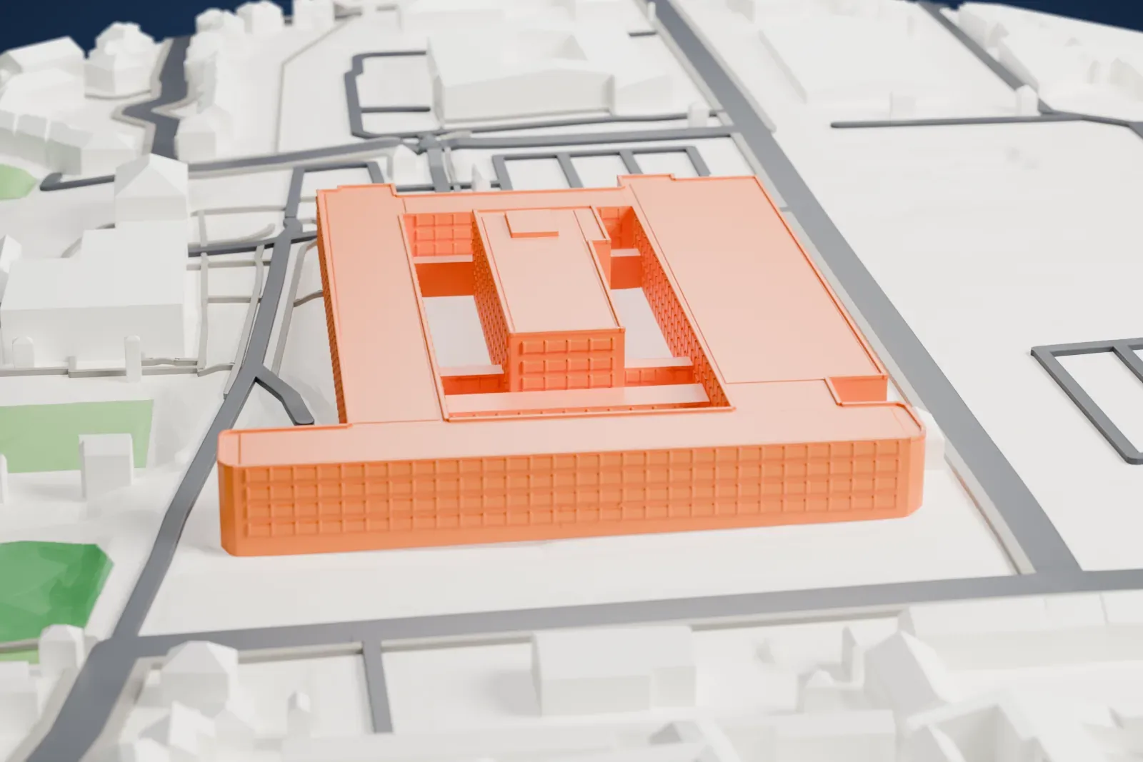 A white 3D print of the Institut national de l'audiovisuel, a low building on its grounds, among the surrounding streets and buildings of Bry-sur-Marne.